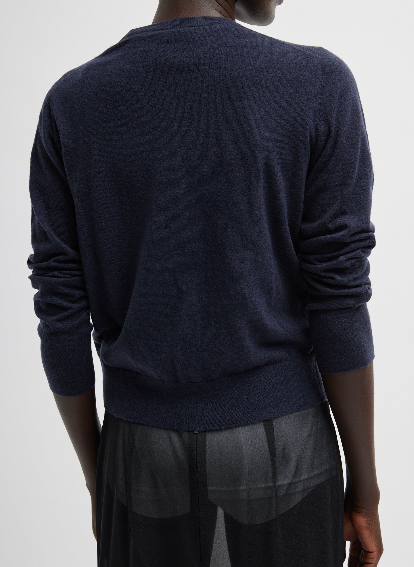 Navy Skinlike Mercerized Wool Shrunken Cardigan - back view on model