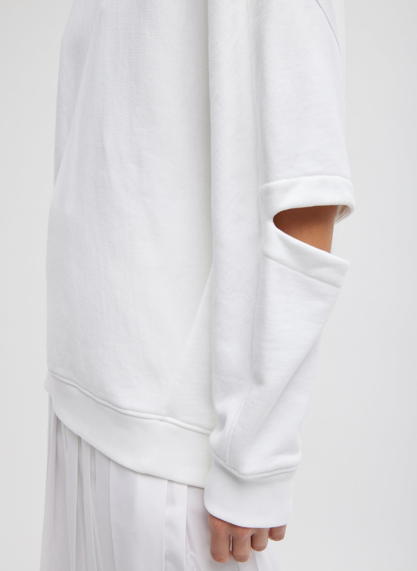 White Cocoon Crewneck Sweatshirt - closeup of cutout detail at elbow