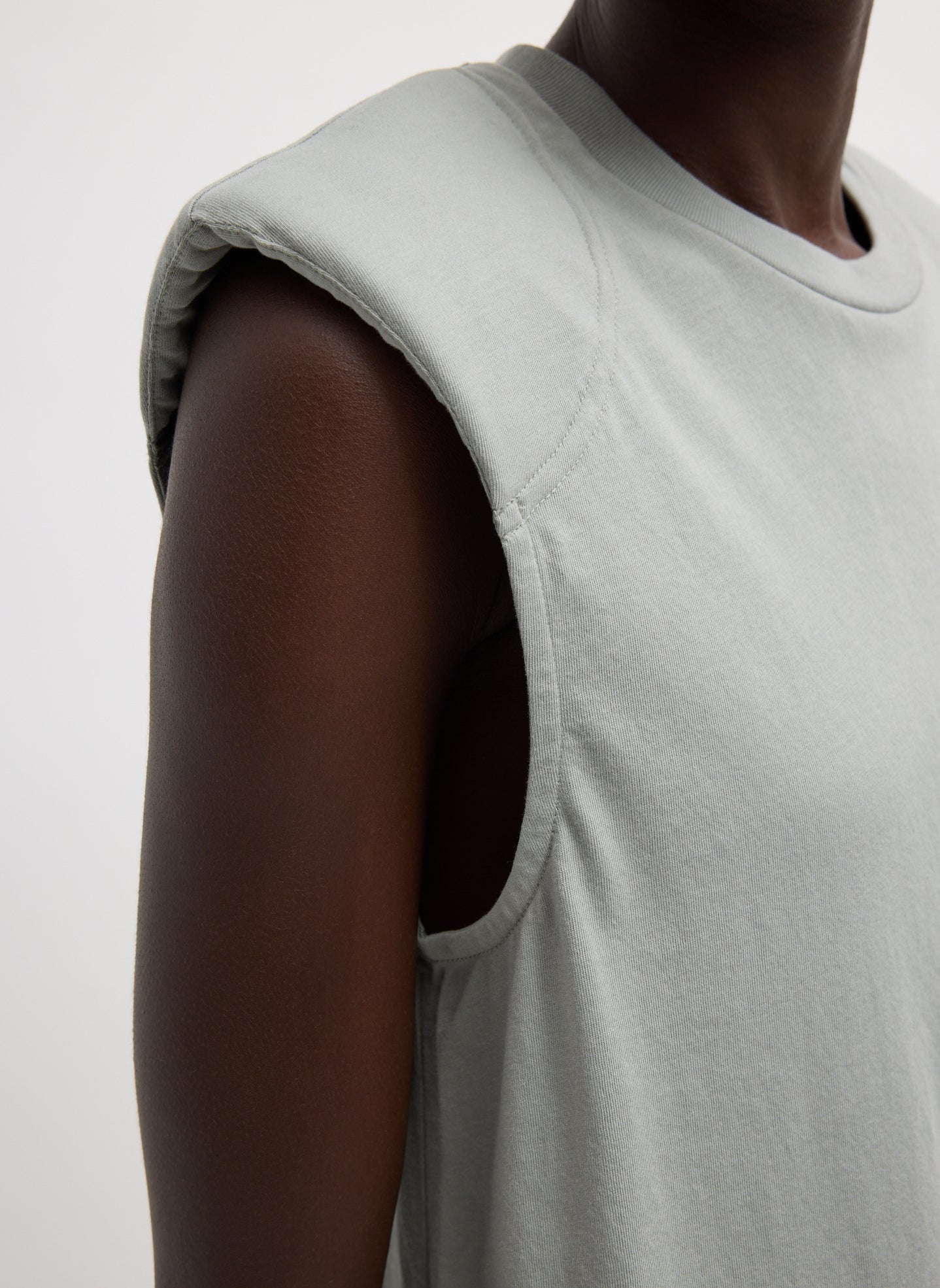 Pumice Grey T-Shirt Program Padded Shoulder Sleeveless Top - closeup of padded shoulder