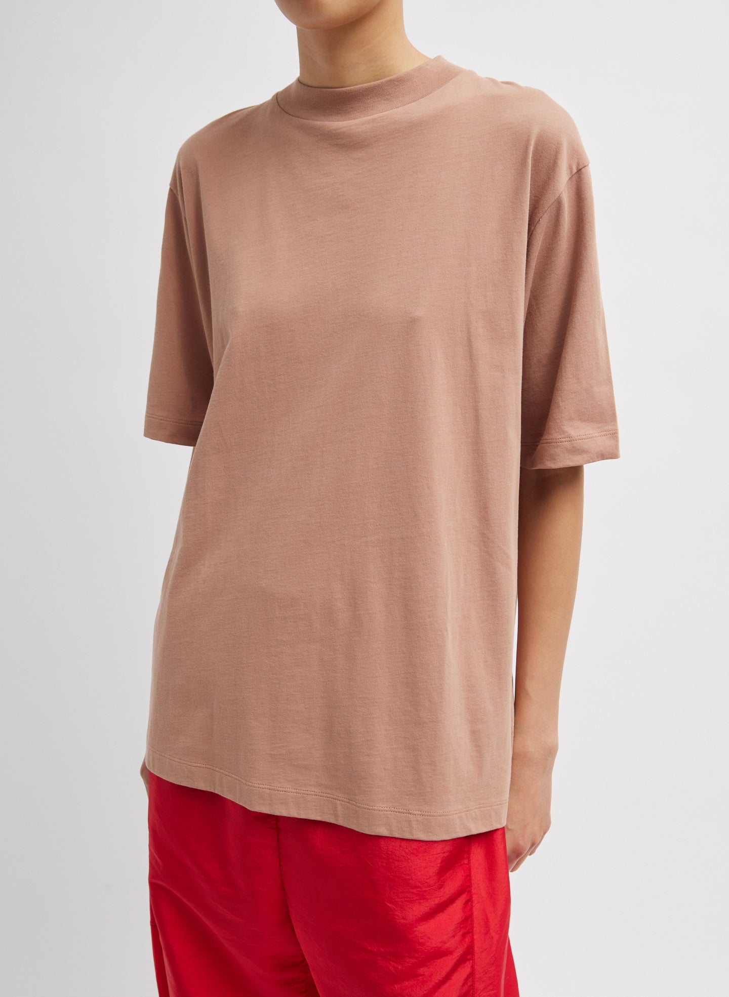 Butterscotch Orange Mock Neck Unisex T-Shirt - oversized fit, front view on model