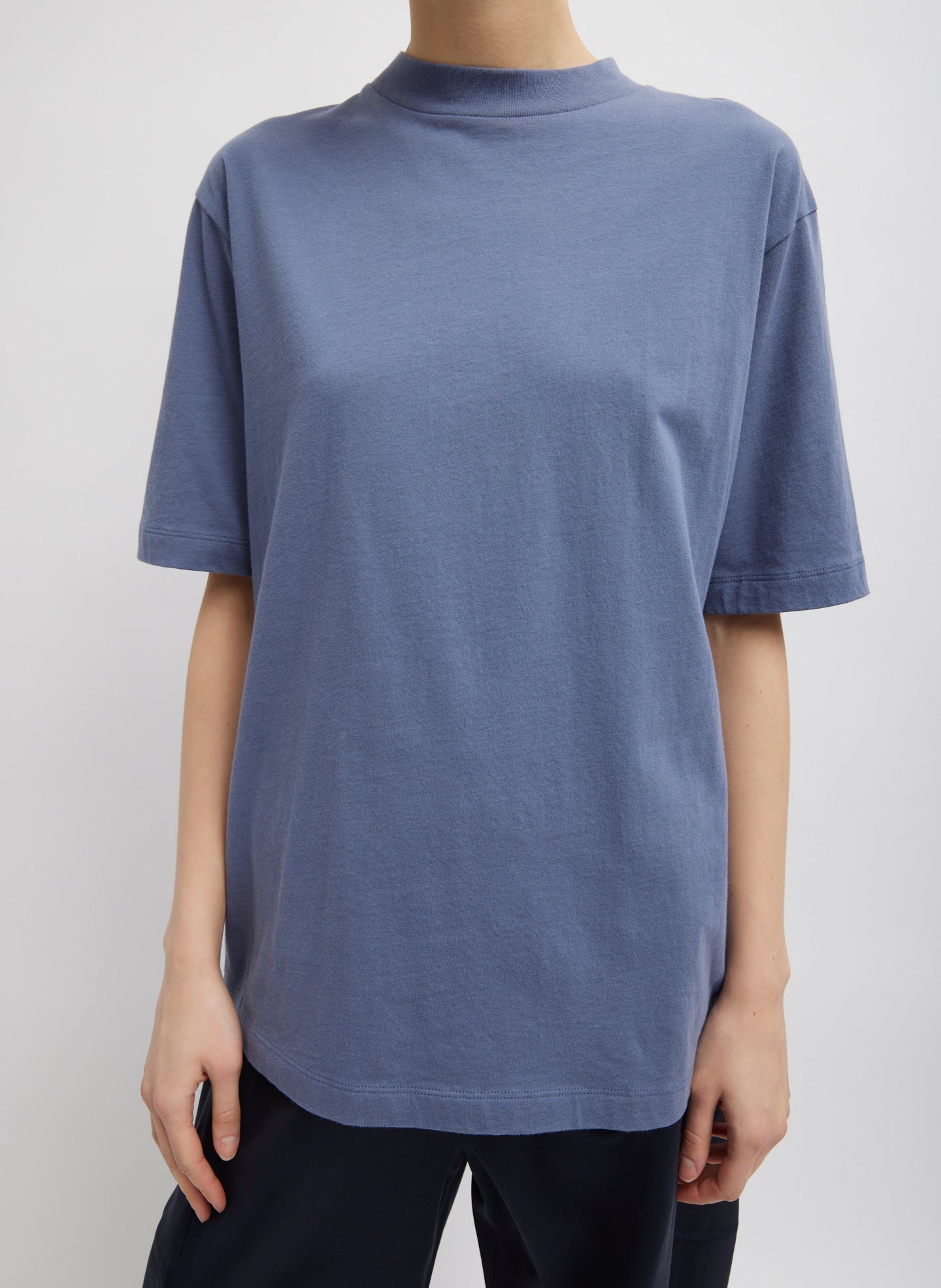 Dusty Navy Blue Mock Neck Unisex T-Shirt - oversized fit, front view on model