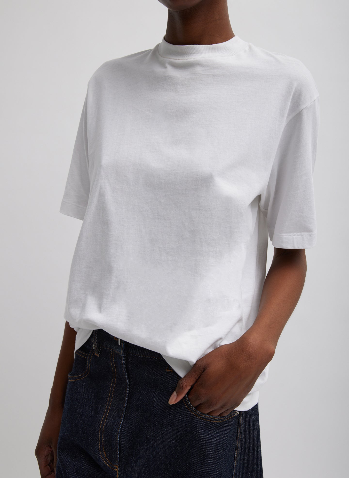 White Mock Neck Unisex T-Shirt - oversized fit, front view on model