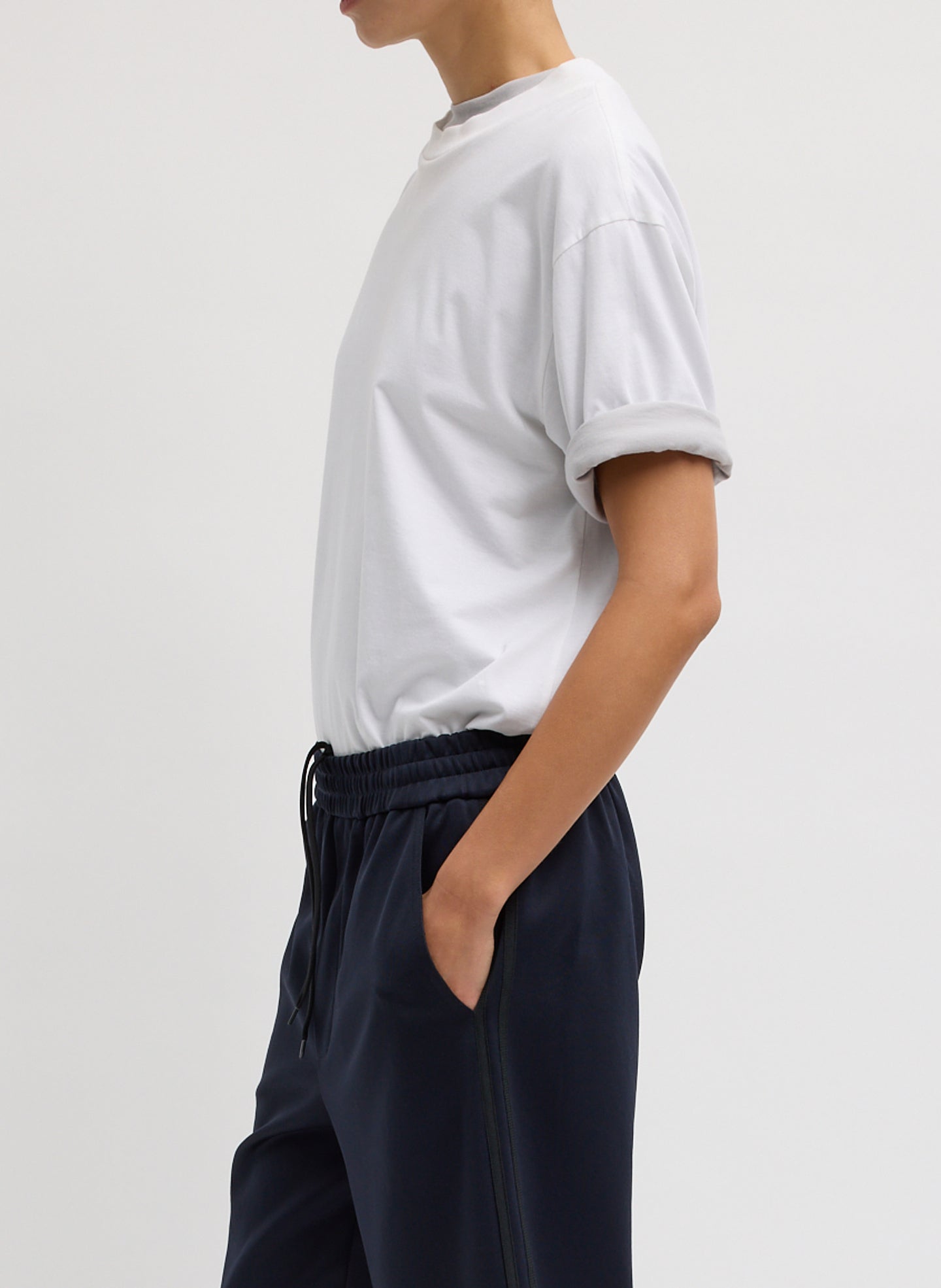 White Mock Neck Unisex T-Shirt - oversized t-shirt, side view on model