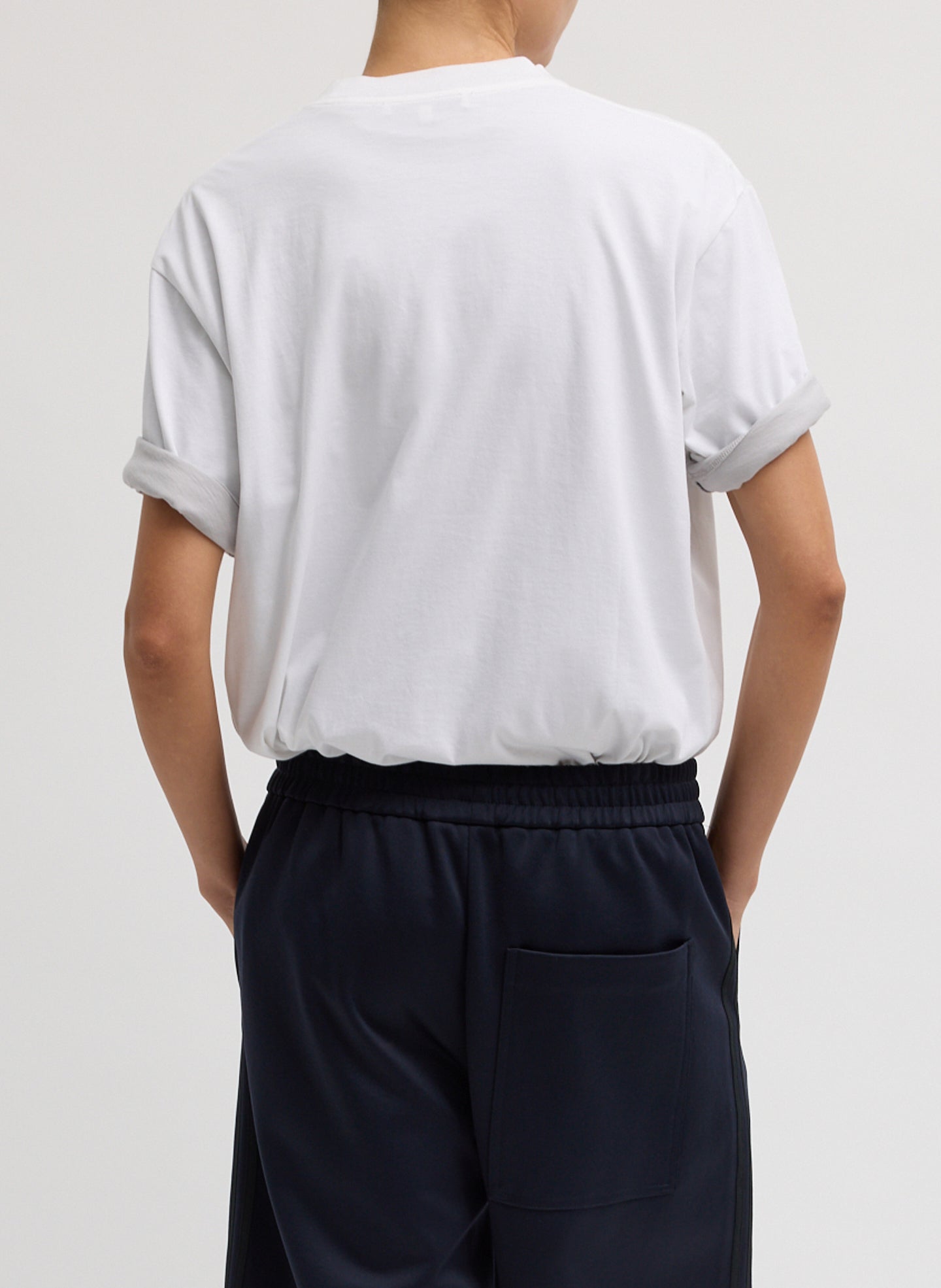 White Mock Neck Unisex T-Shirt - oversized t-shirt, back view on model