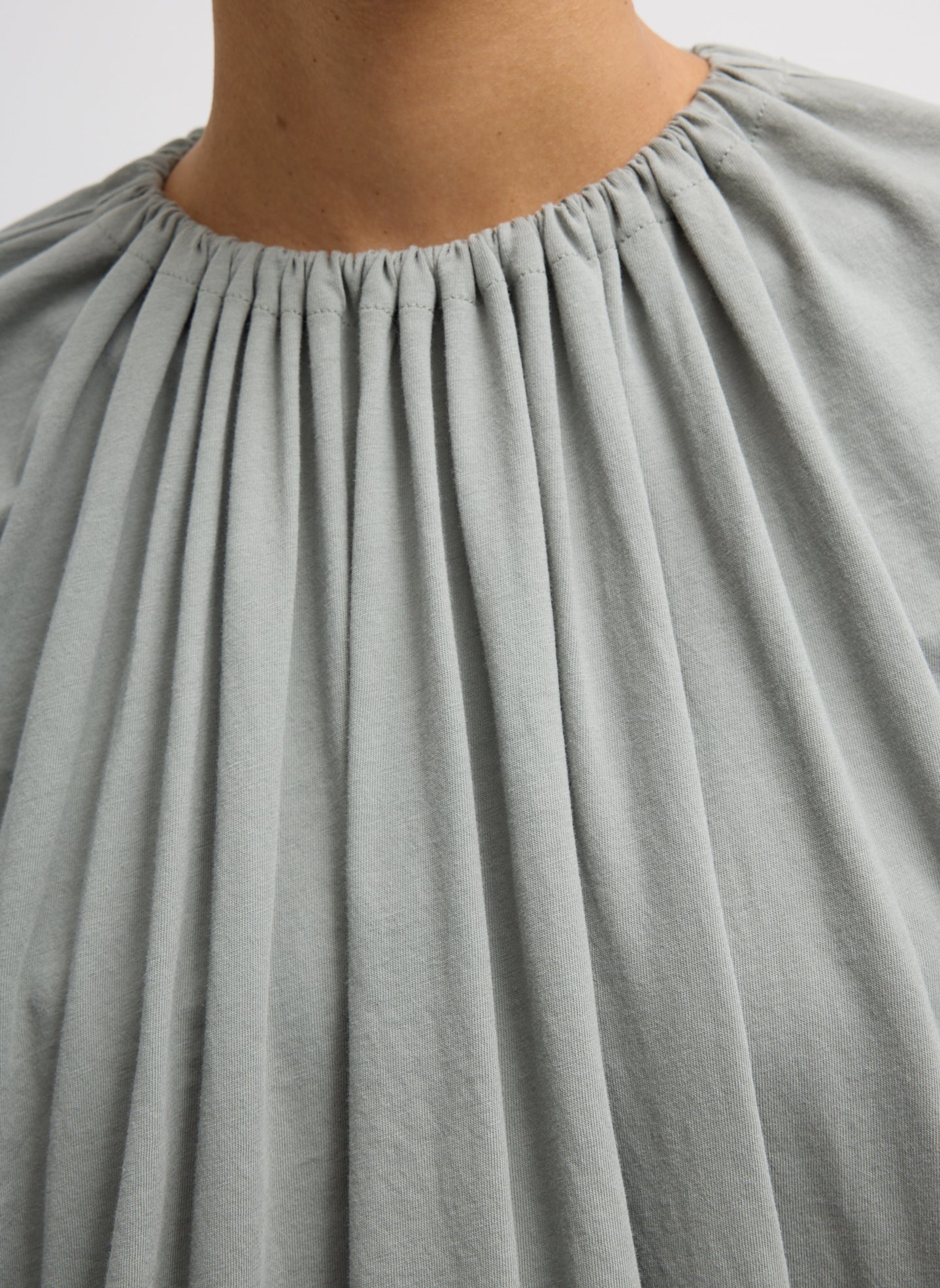 Pumice Grey T-Shirt Program Shirred Neck Sleeveless Top - closeup of shirred neckline