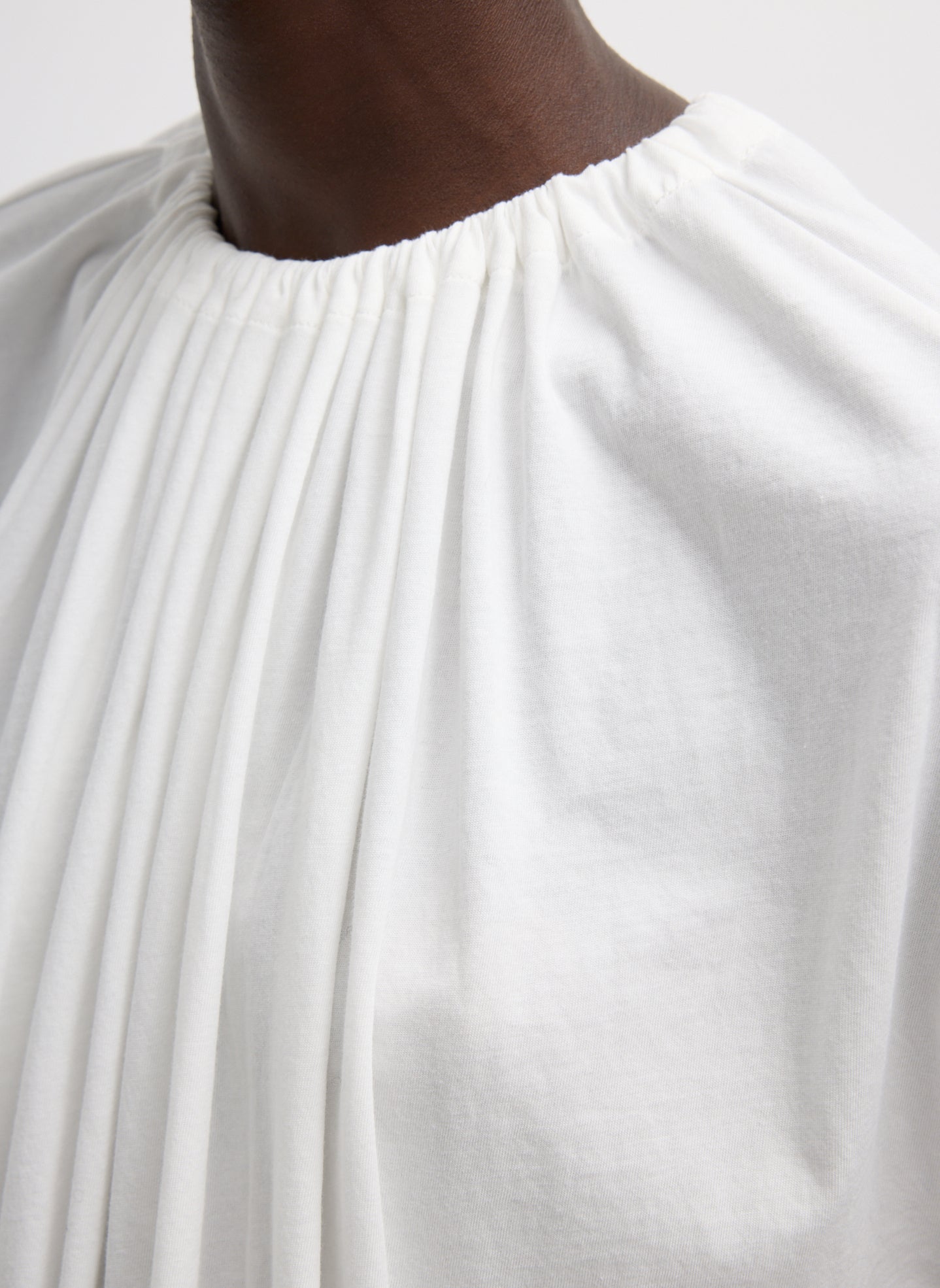 White T-Shirt Program Shirred Neck Sleeveless Top - closeup of shirred neckline