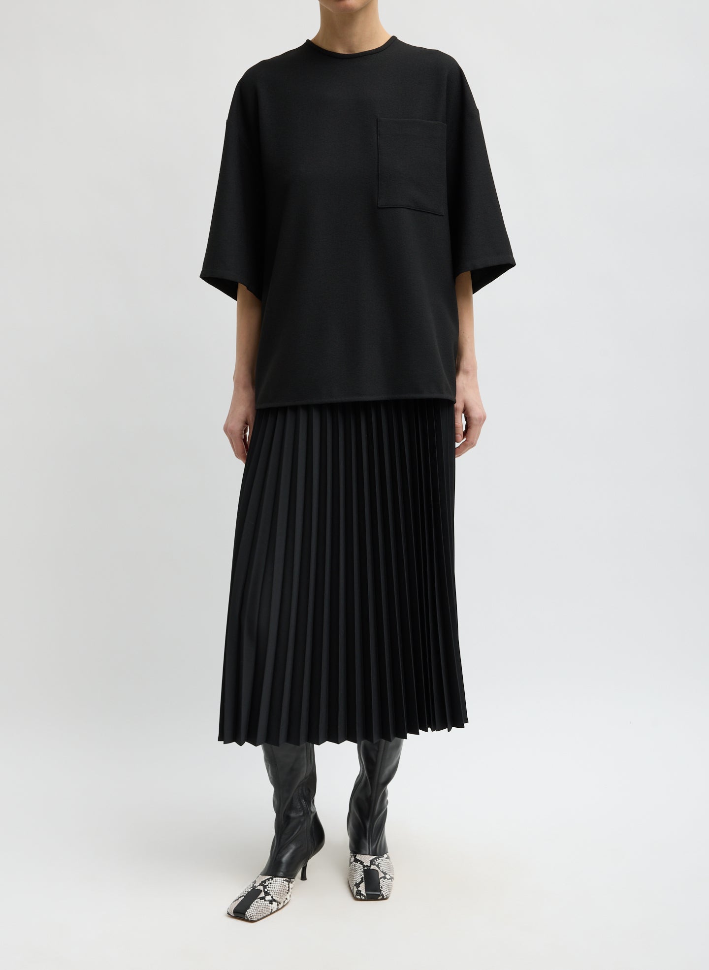 Black Tropical Wool Pleating Sunray Skirt - full look, side view on model