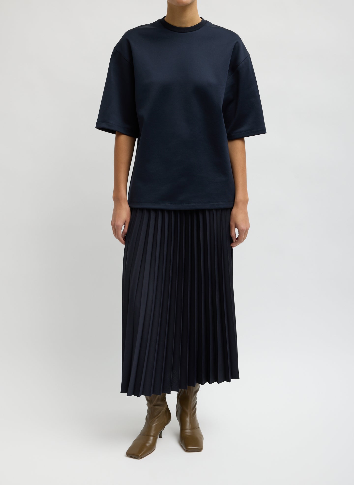 Navy Tropical Wool Pleating Sunray Skirt - pleated midi skirt, front view on model