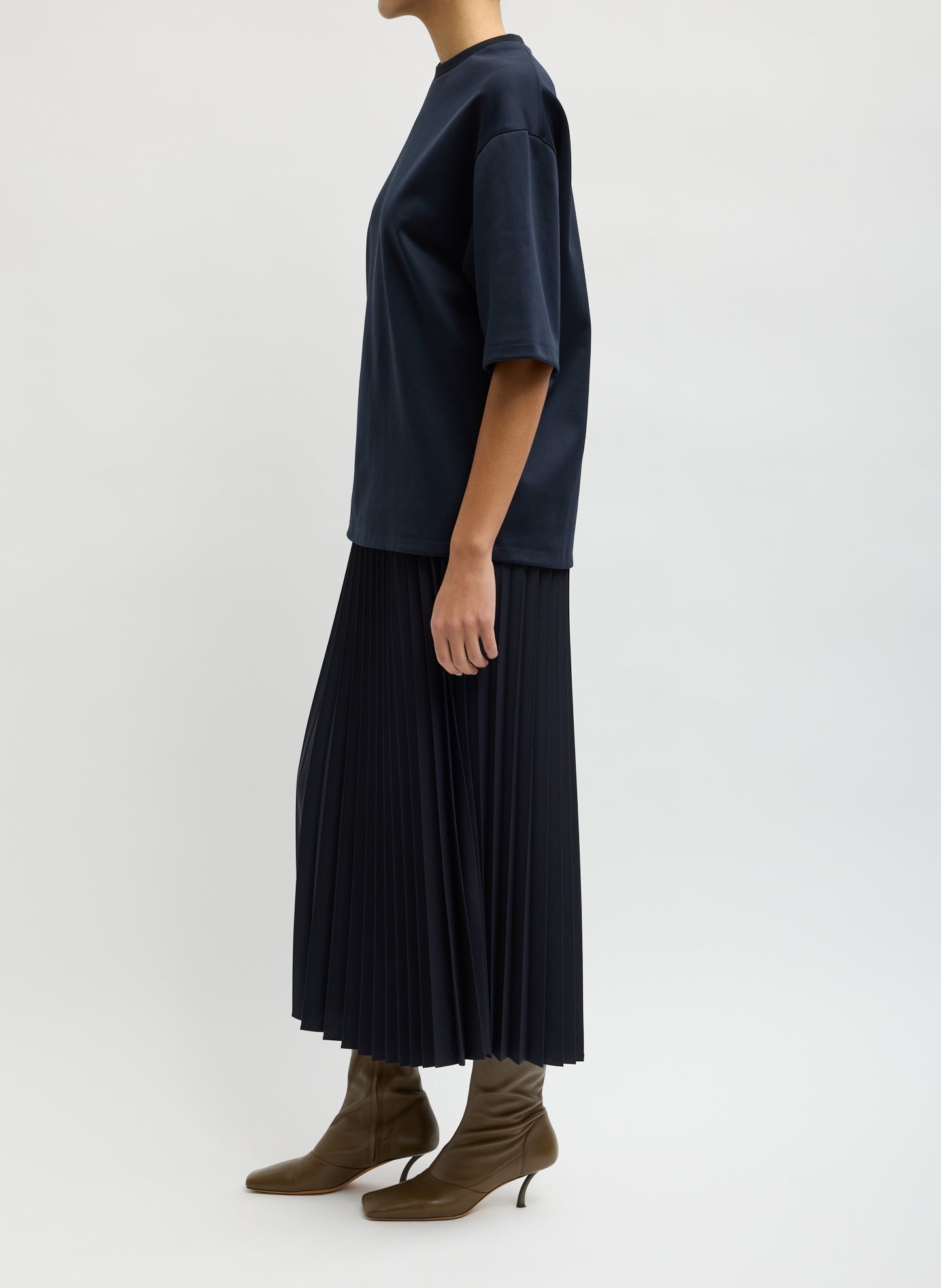 Navy Tropical Wool Pleating Sunray Skirt - pleated midi skirt, side view on model