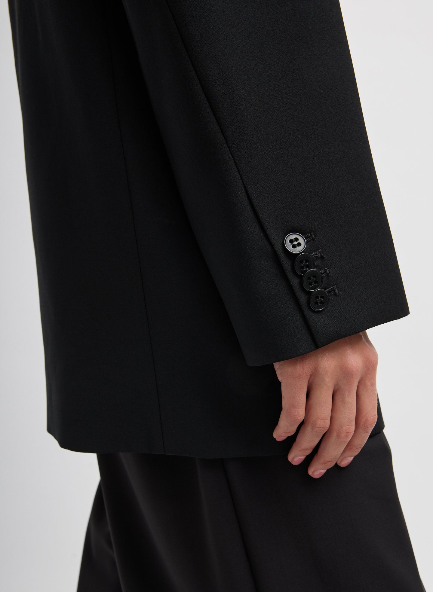 Black Tropical Wool Liam Blazer - closeup of button details at sleeve