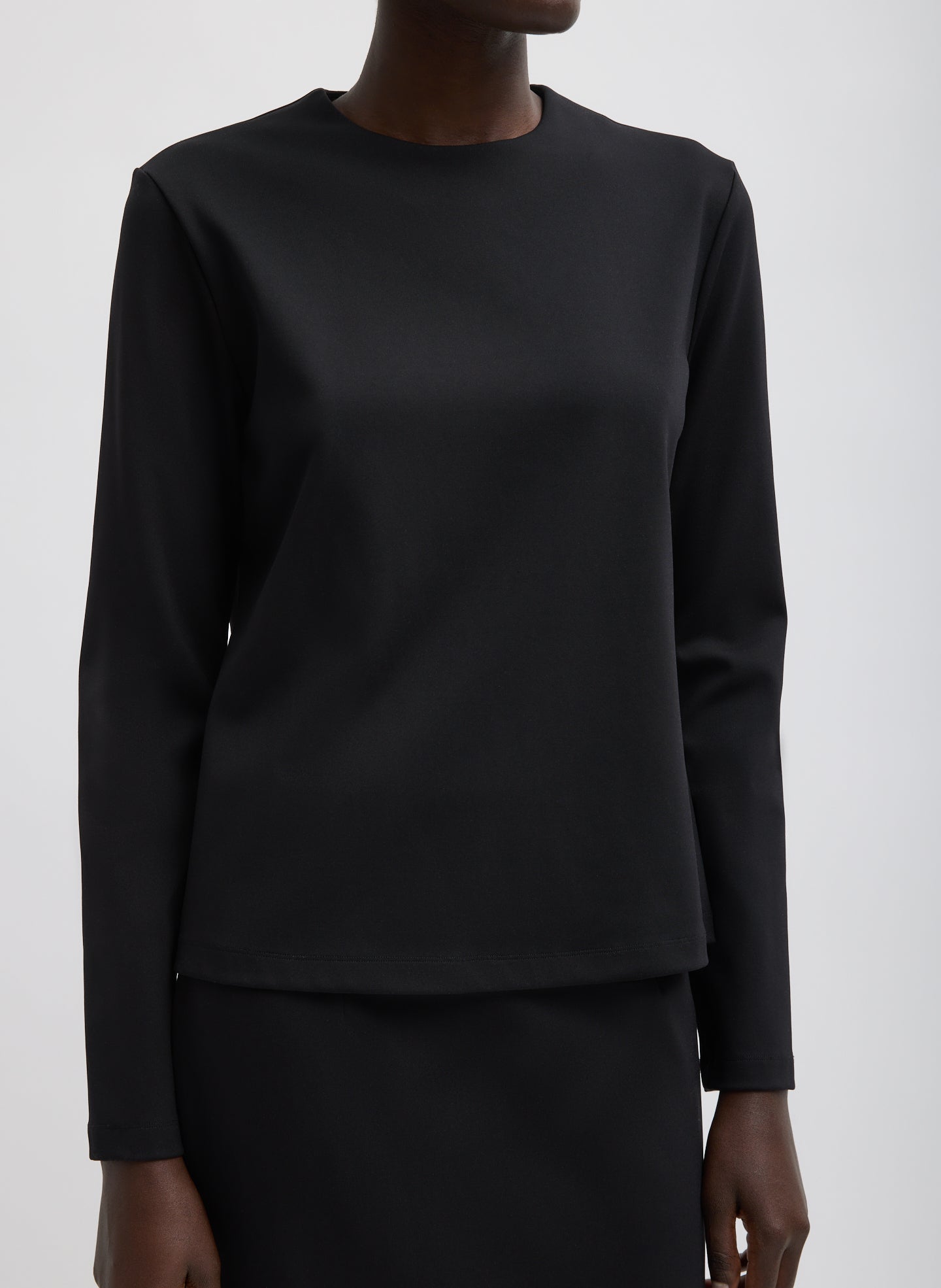 Black Compact Ultra Stretch Knit Long Sleeve Slim Top - front view on model