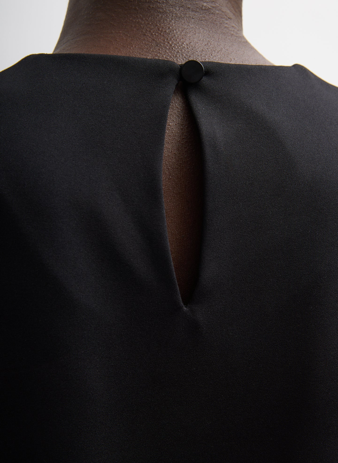 Black Compact Ultra Stretch Knit Long Sleeve Slim Top - closeup of button detail at back