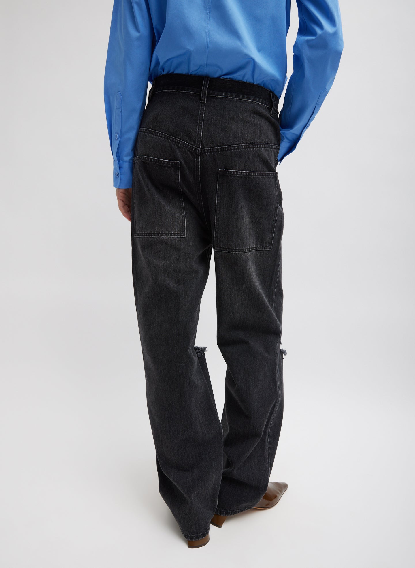 Vintage Black Denim Ryder Jean - ripped jeans, back view on model