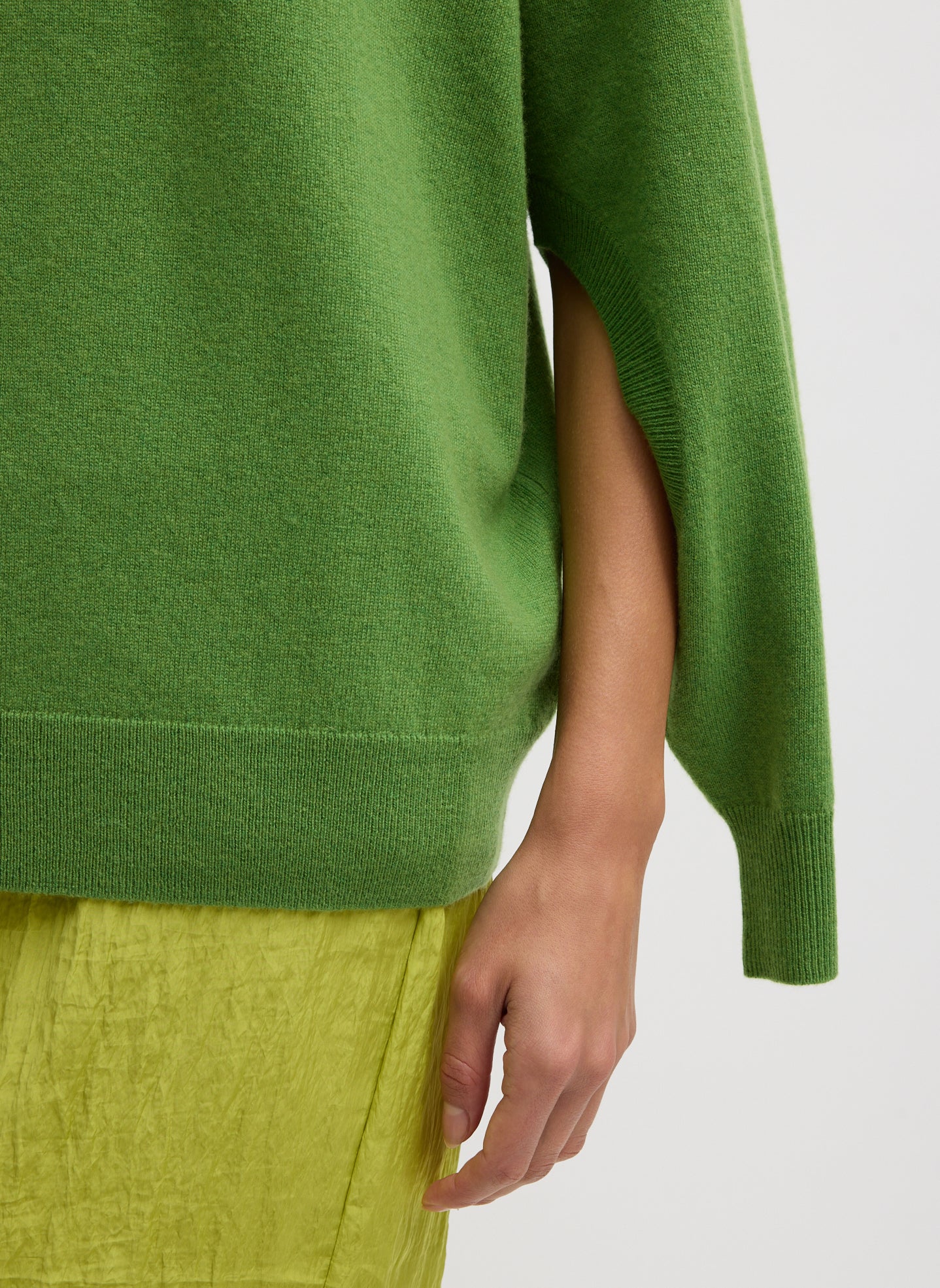 Avocado Green Washable Cashmere Crewneck Cutout Sleeve Sweater - closeup of cutout detail at sleeve