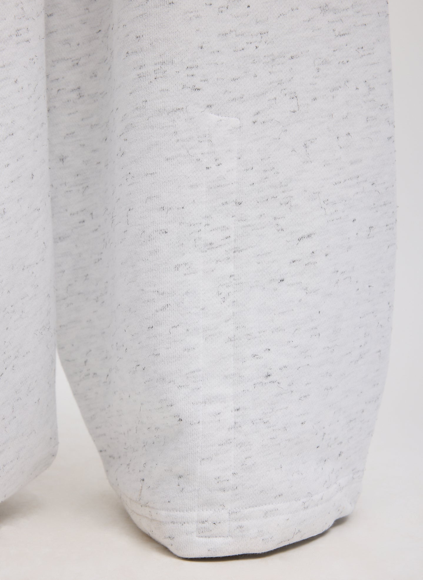 White Multi Spring Tweedy Sweatshirting Winslow Pant - closeup of hidden snap details at hem