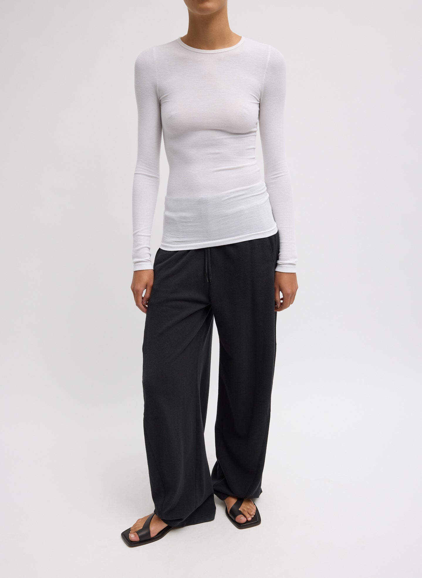 Black Light Weight Sweatshirting Winslow Pant - barrel leg sweatpant, front view on model