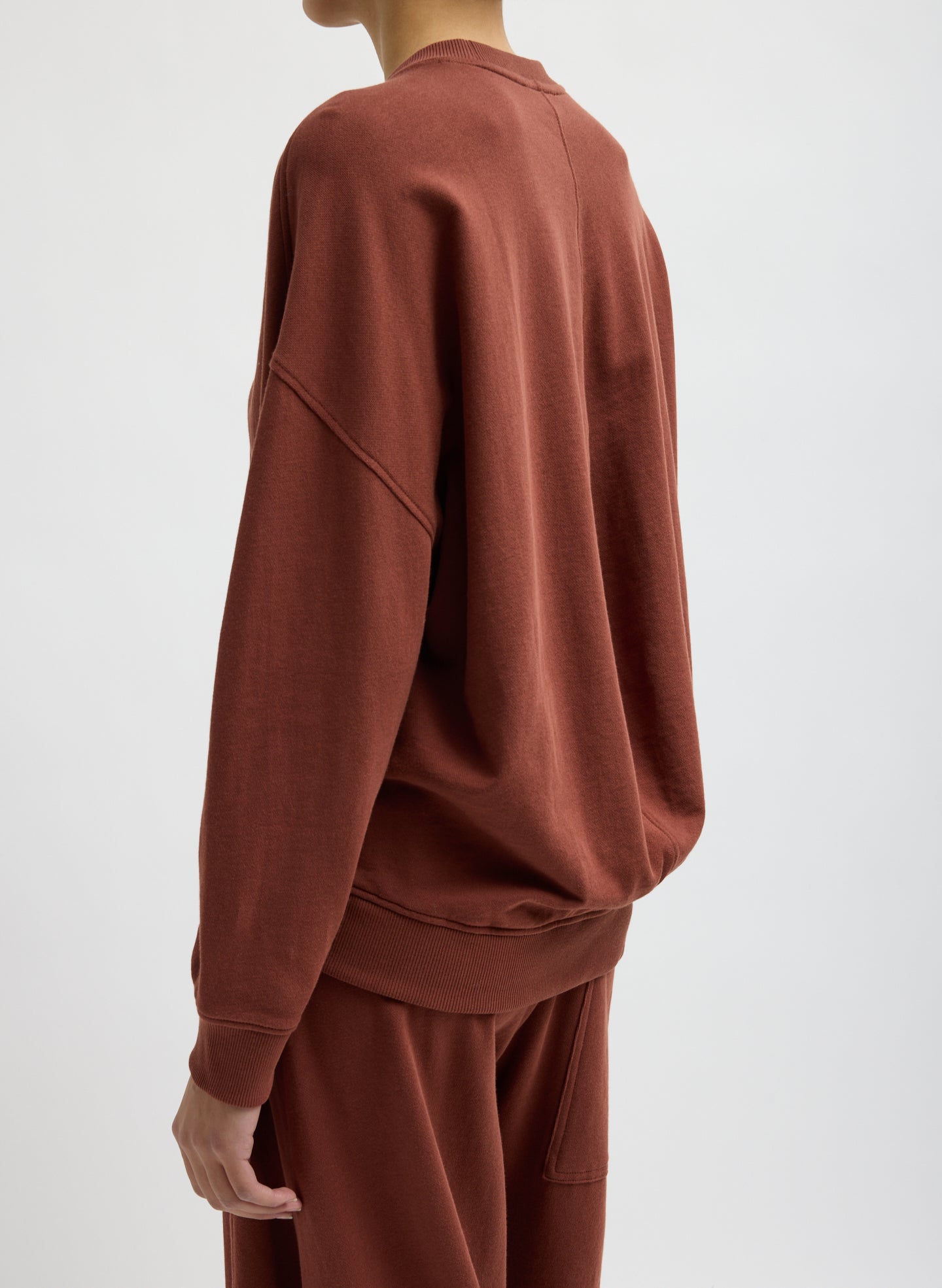 Red Clay Light Weight Sweatshirting Crewneck Sweatshirt - side view on model