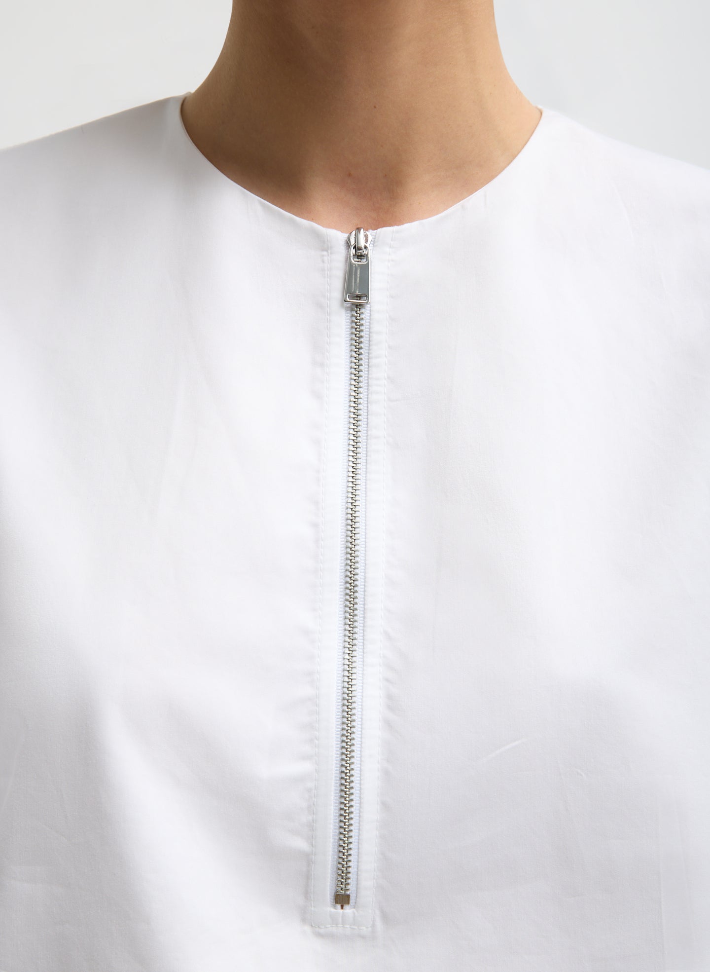 White Eco Poplin Balloon Origami Top - closeup of zip front detail