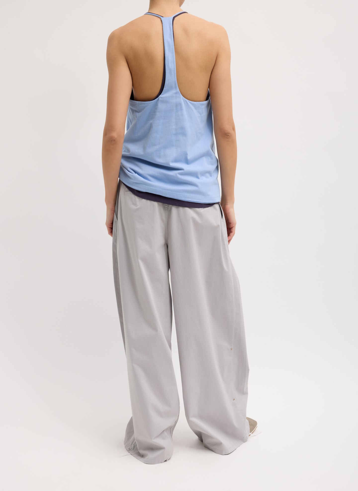 Light Grey Garment Dyed Silky Cotton Triple Pleat Pant - oversized trouser, back view on model