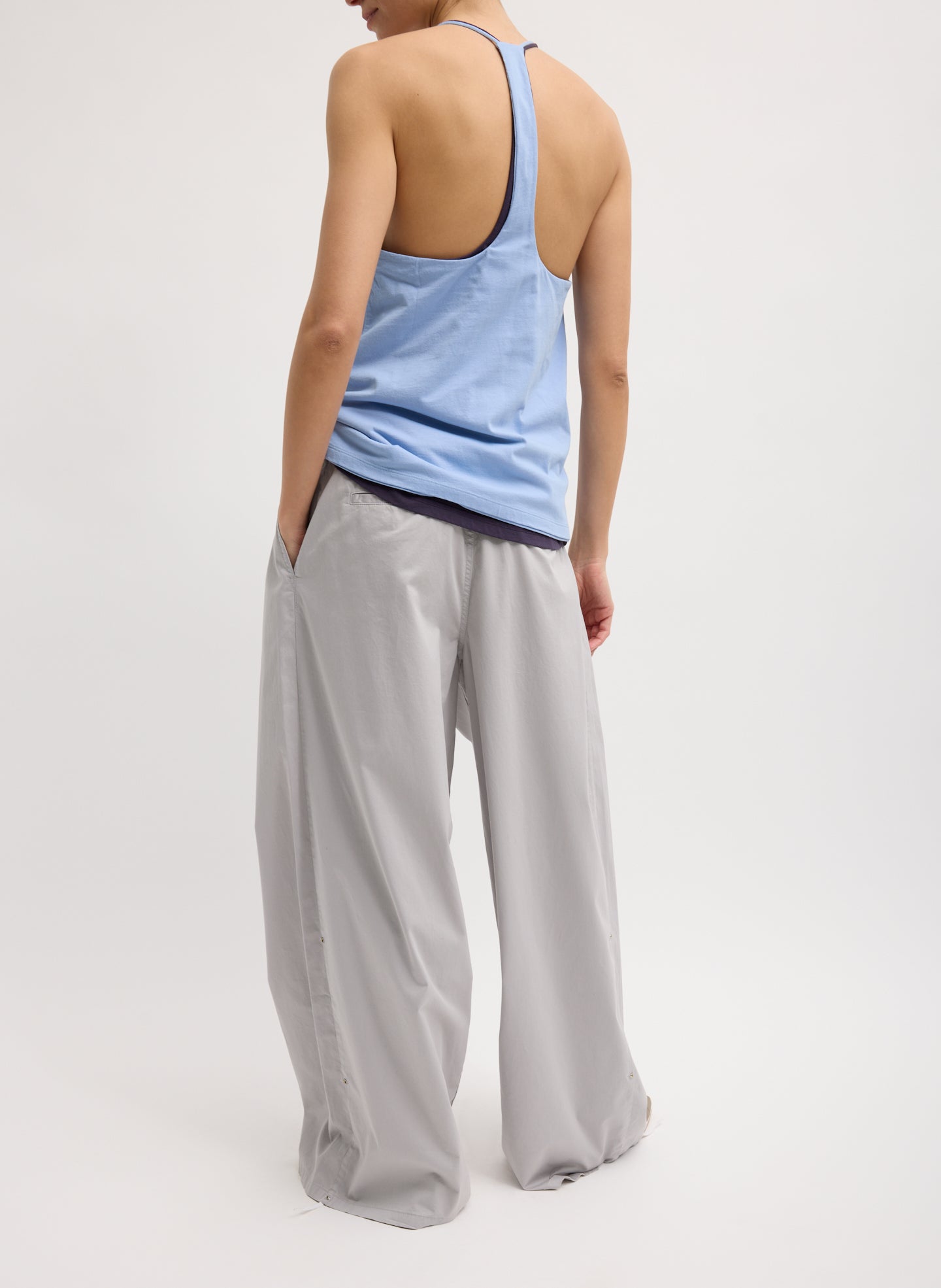 Light Grey Garment Dyed Silky Cotton Triple Pleat Pant - oversized trouser, back view on model