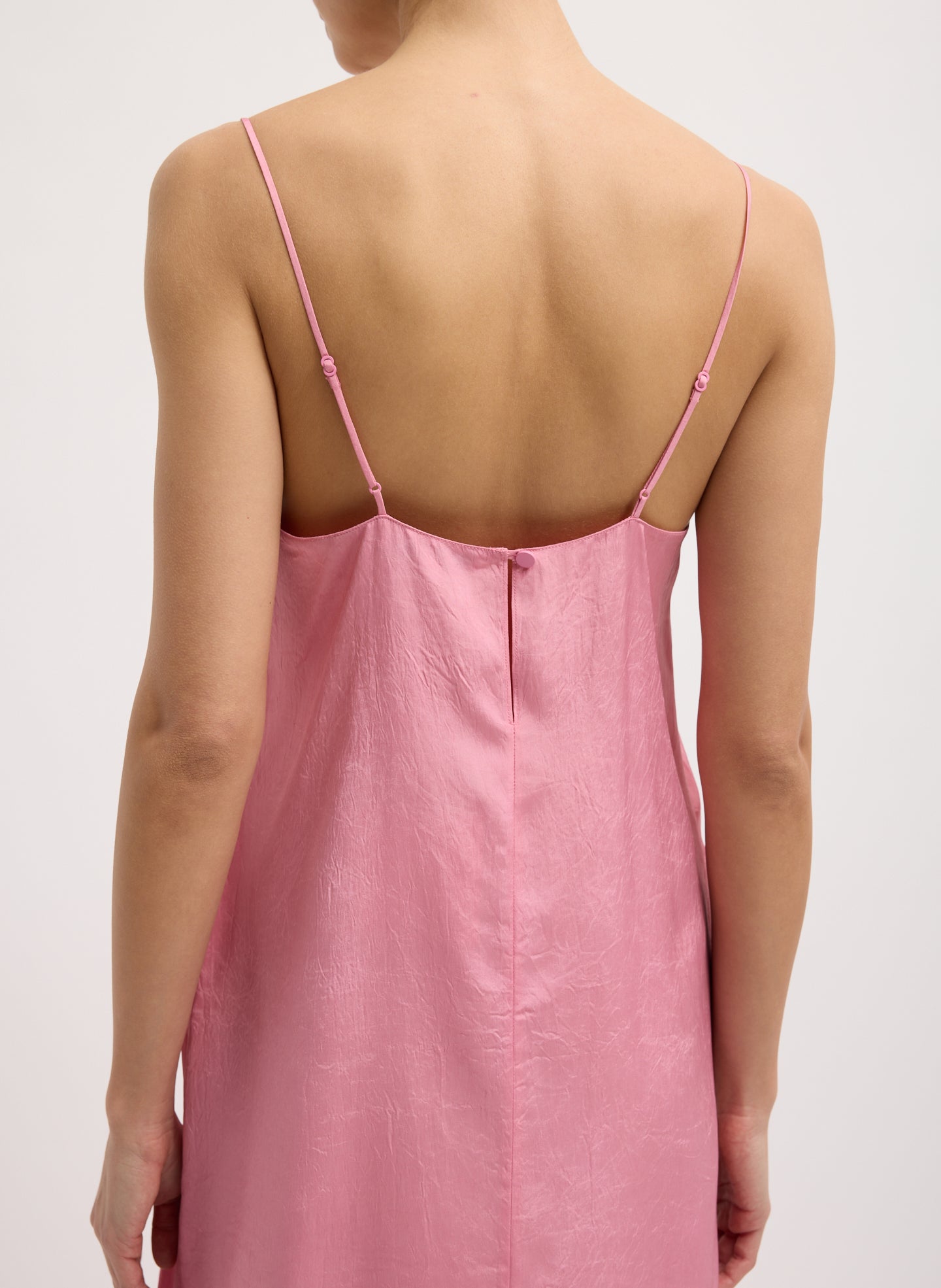 Pink Summer Acetate Crinkle Slip Dress - close up of adjustable straps and button closure at back