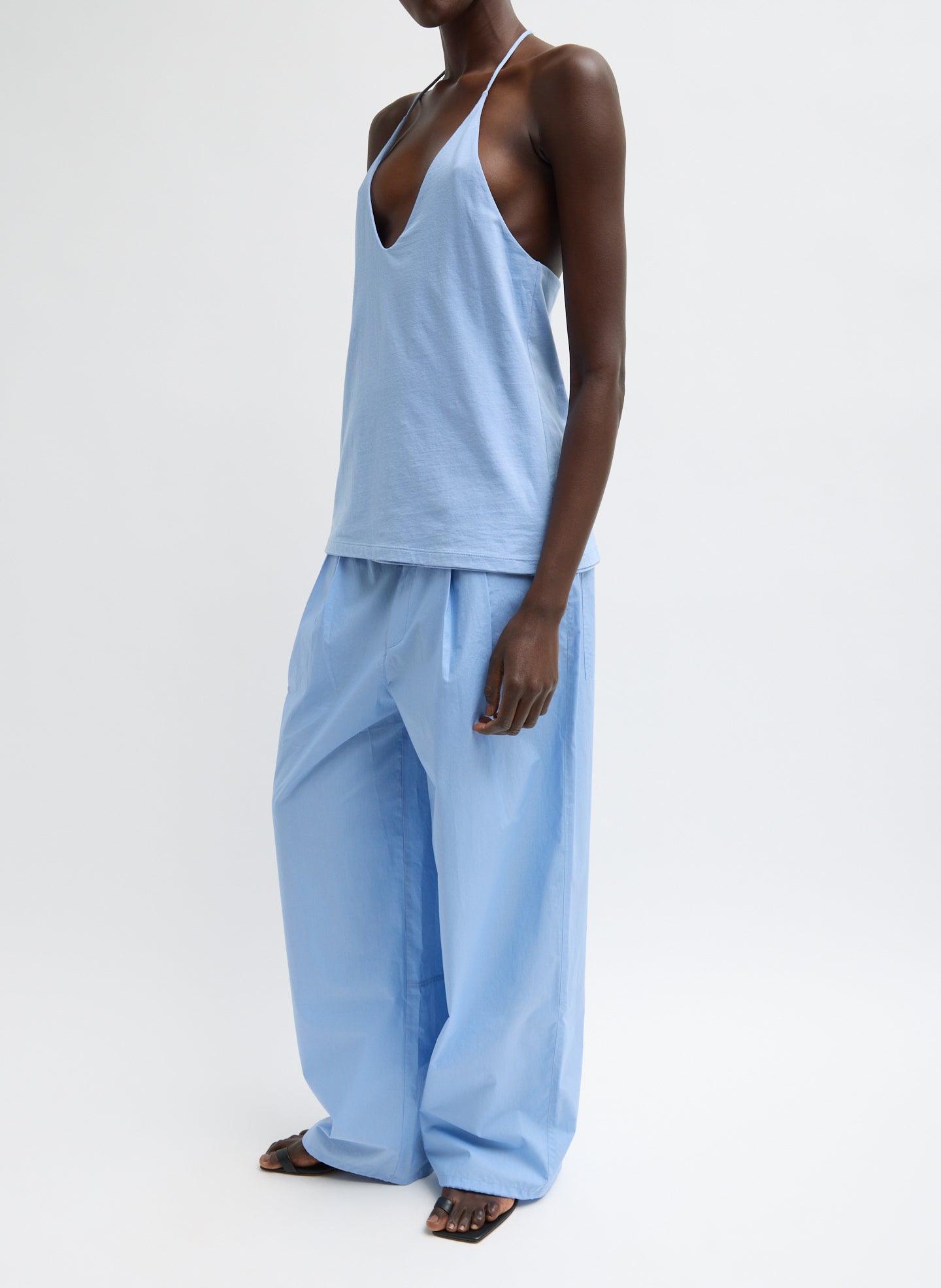 Light Blue Racerback Tank - full look, side view on model