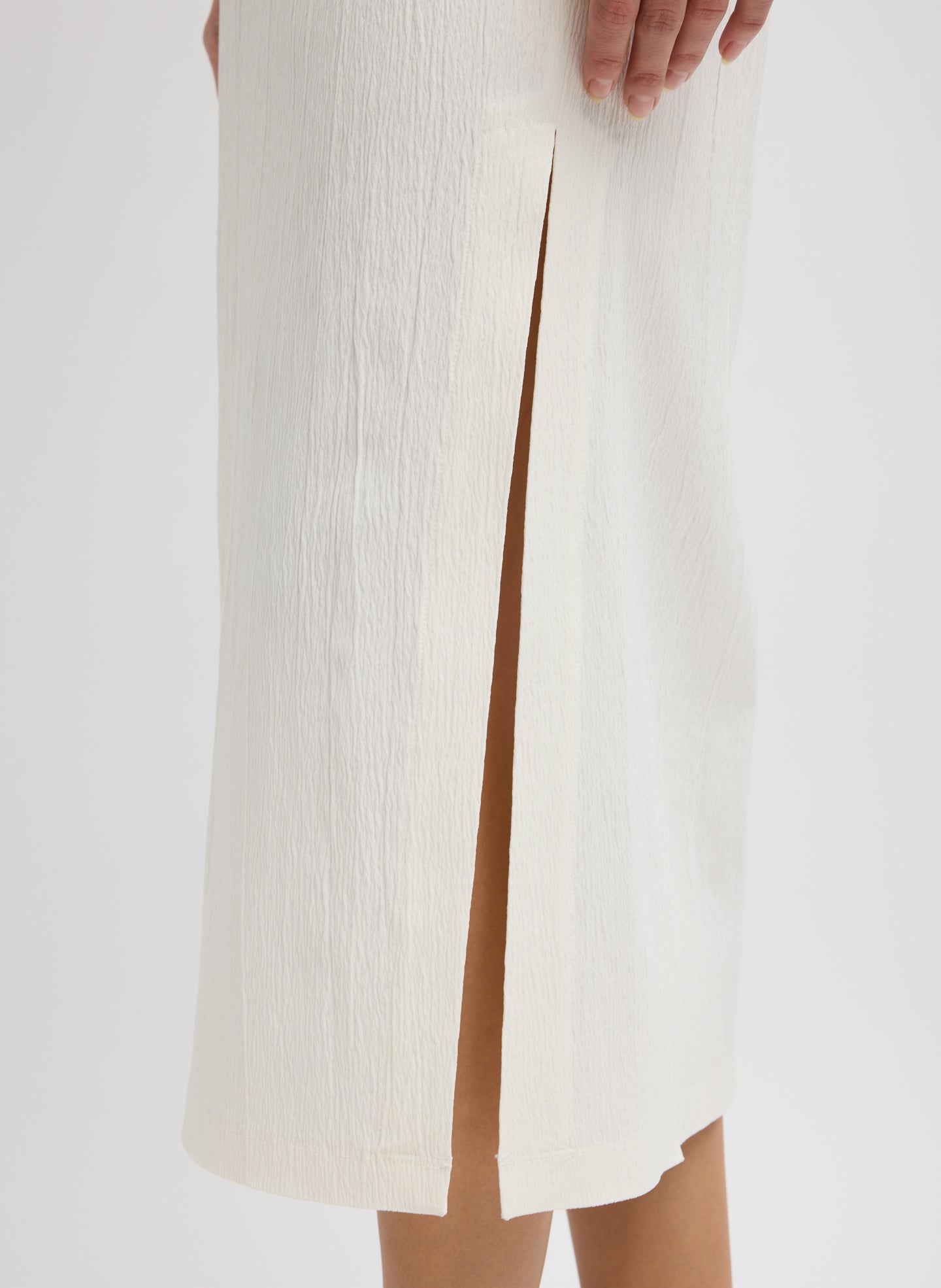 Ivory Creased Stretch Crepe Skirt - closeup of slit detail