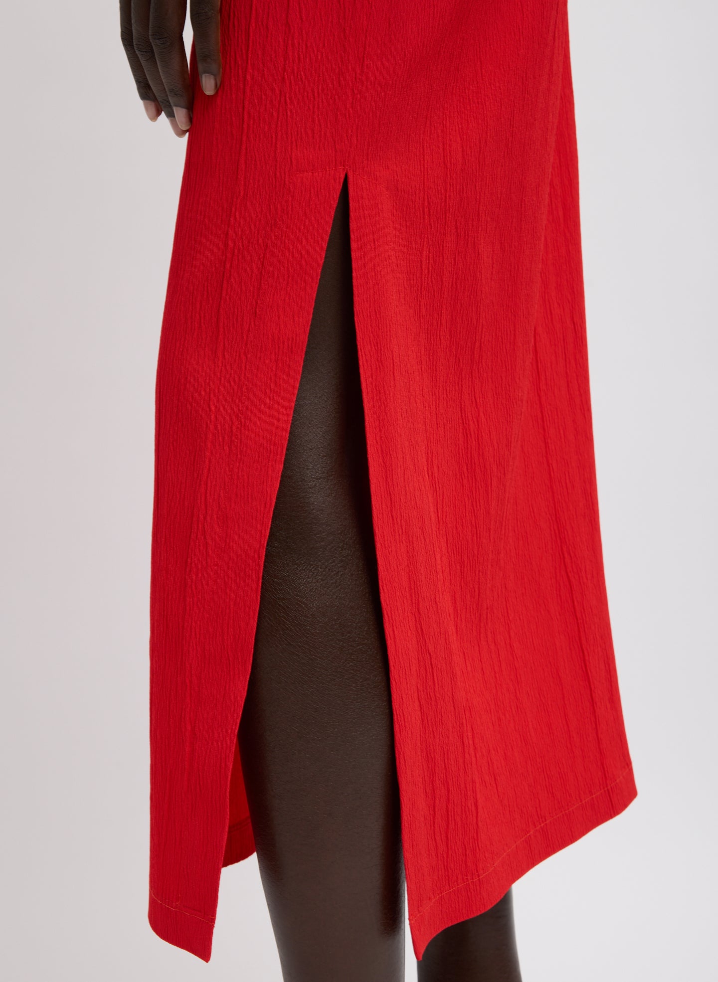 Red Creased Stretch Crepe Skirt - closeup of slit detail