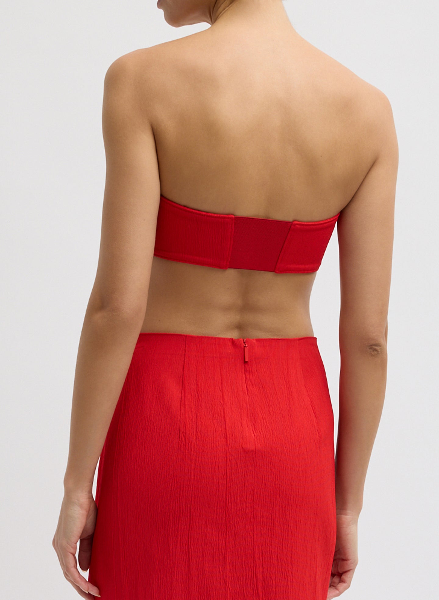 Red Creased Stretch Crepe Strapless Bralette - zip front, back view on model