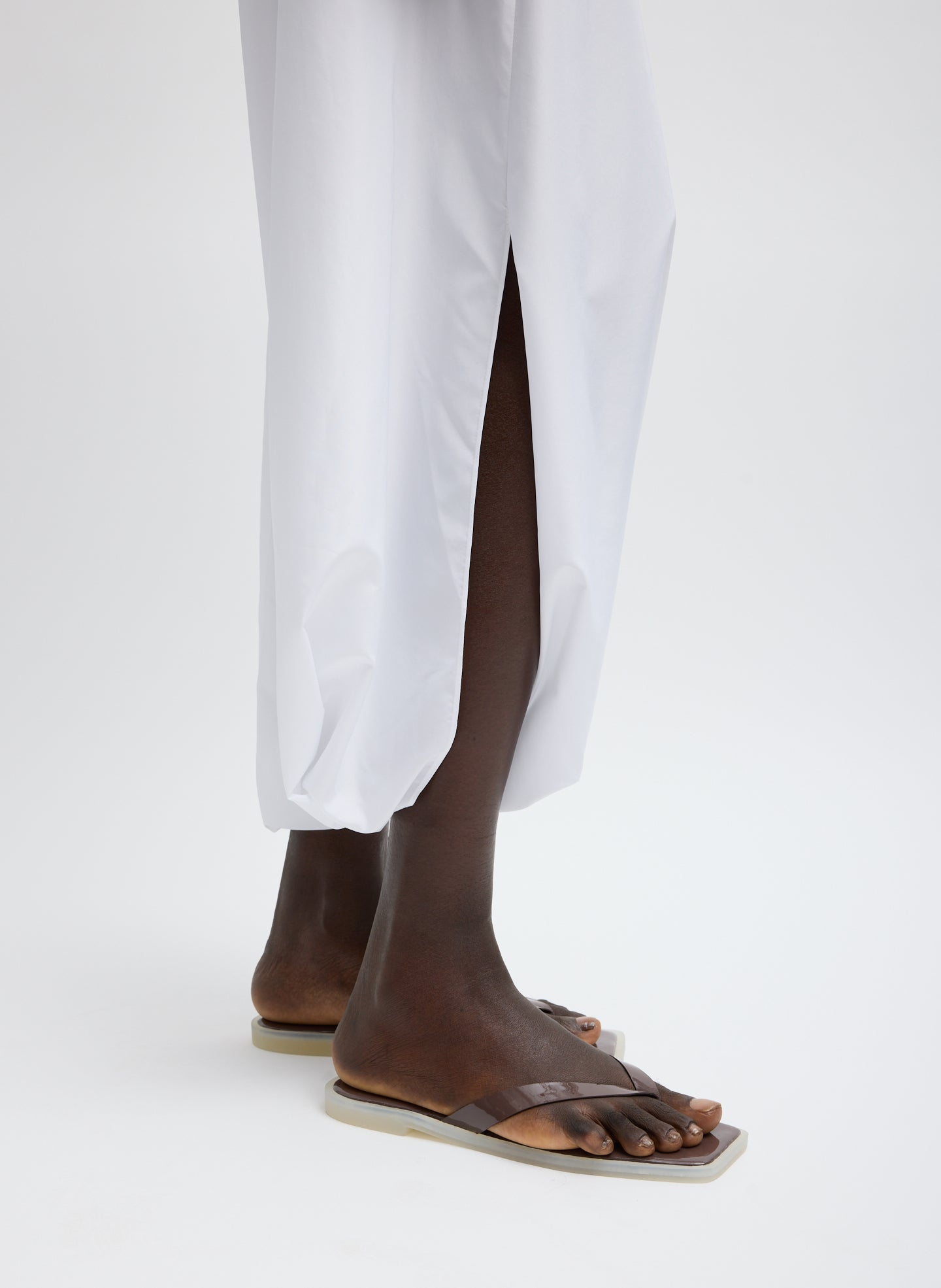 White Summer Nylon Jalouise Midi Skirt - closeup of slit detail
