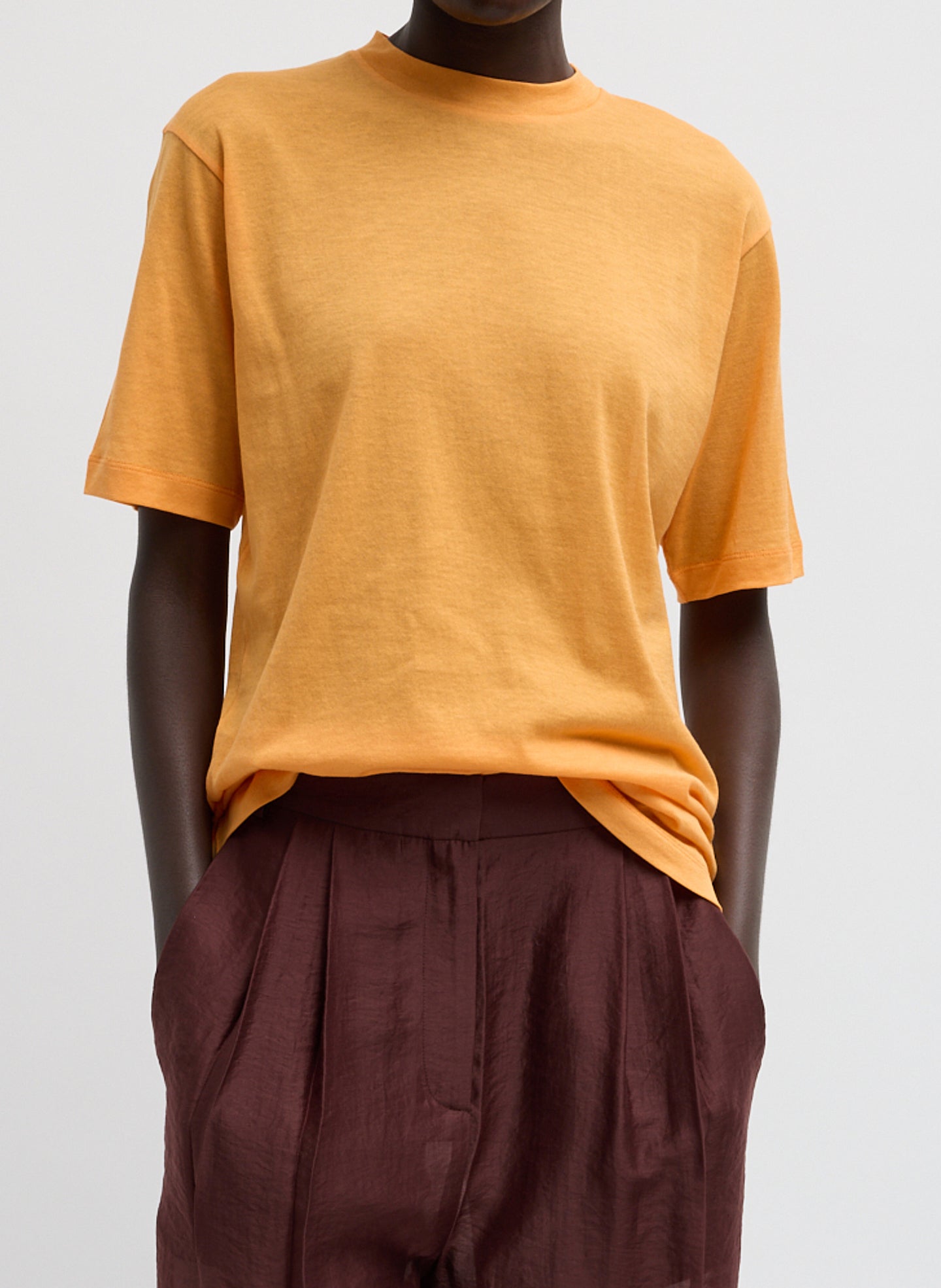 Orange Sheer Crepe Knit Mock Neck Unisex T-Shirt - front view on model