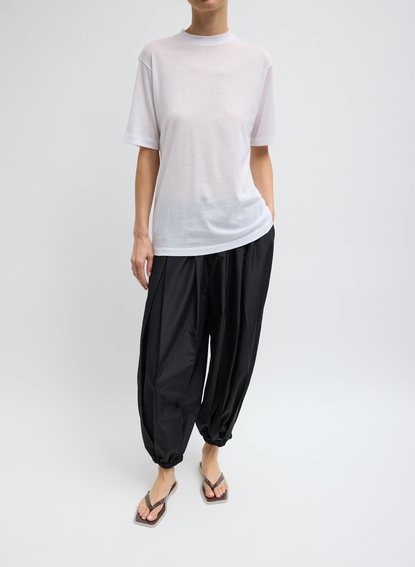 White Sheer Crepe Knit Mock Neck Unisex T-Shirt - full look, front view on model