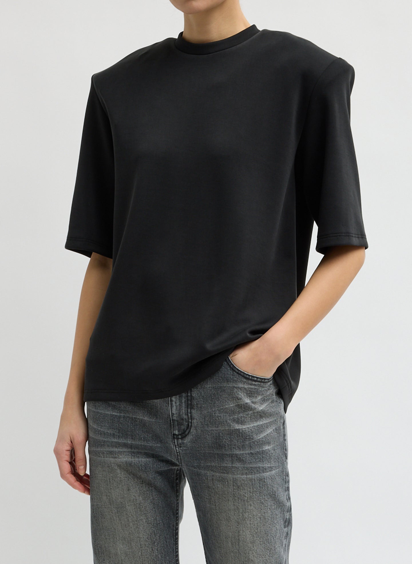 Black Feather Weight Viscose Neoprene Removable Shoulder Pad Top - short sleeve t-shirt, front view on model