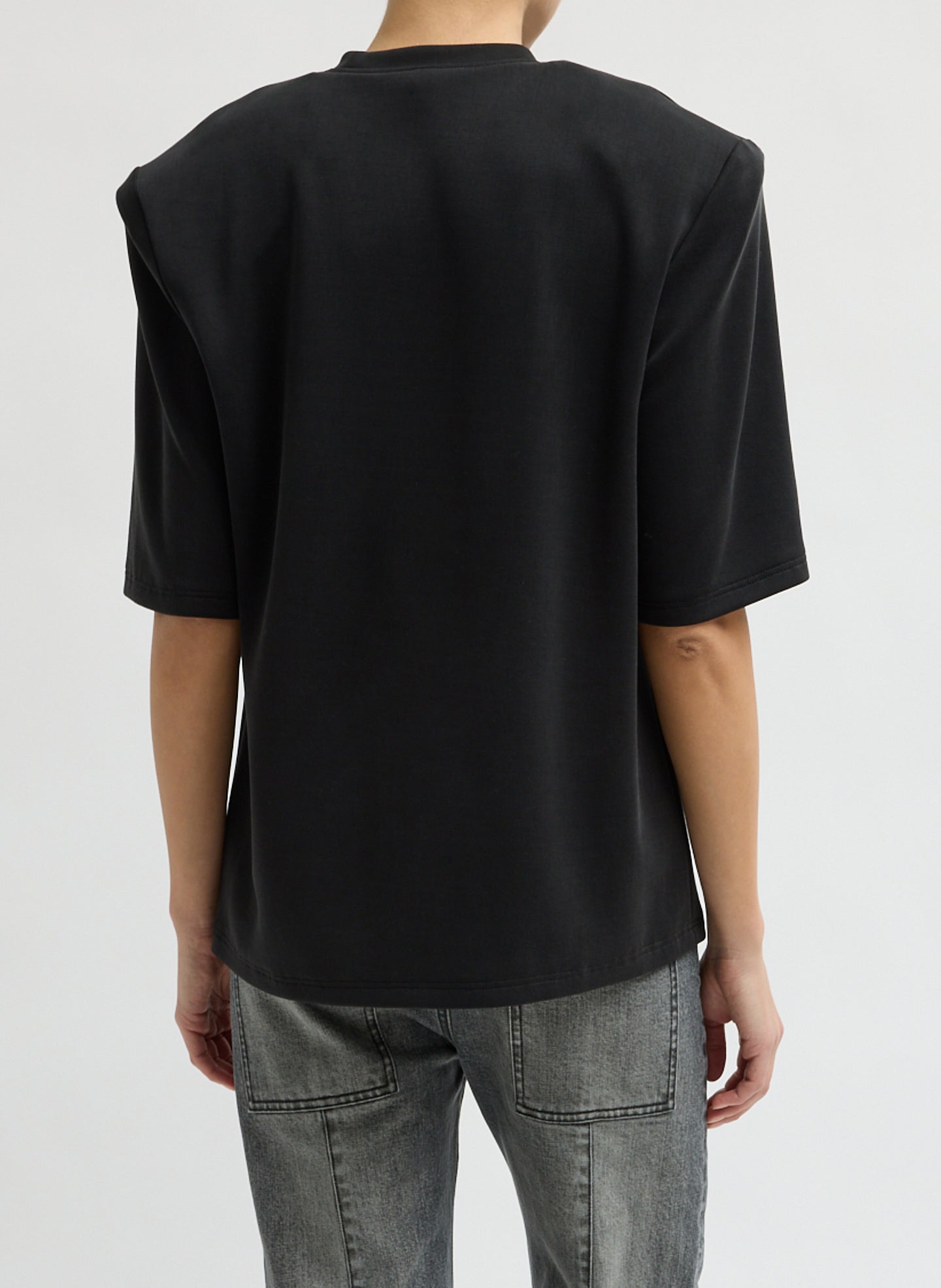 Black Feather Weight Viscose Neoprene Removable Shoulder Pad Top - short sleeve t-shirt, back view on model