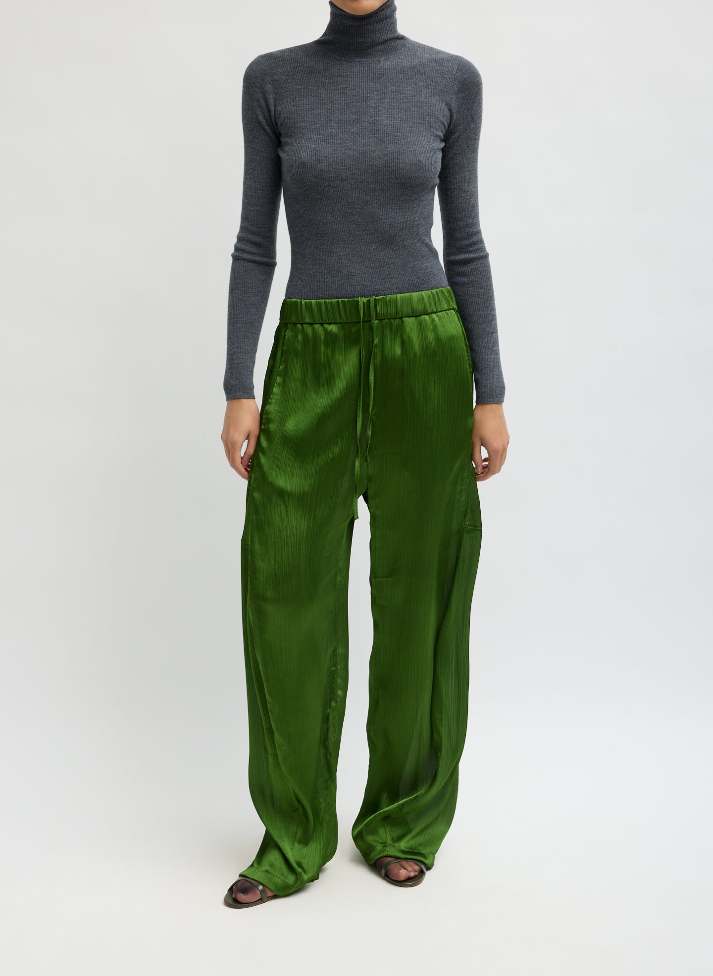 Matte Satin Plisse Winslow Pant - Green Matte Satin Plisse Winslow Pant - barrel leg satin pant, front view on model