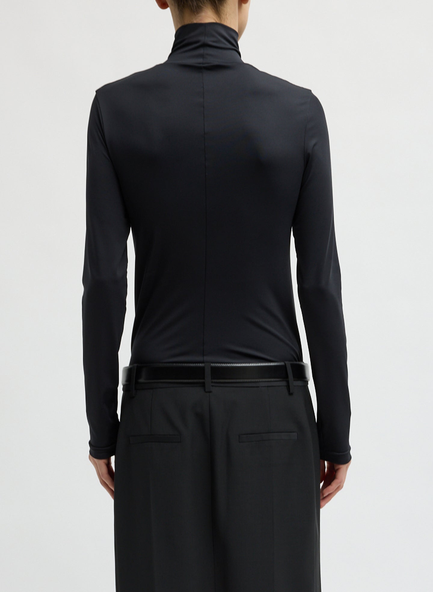 Black Stretch Light Weight Tech Knit Turtleneck - back view on model