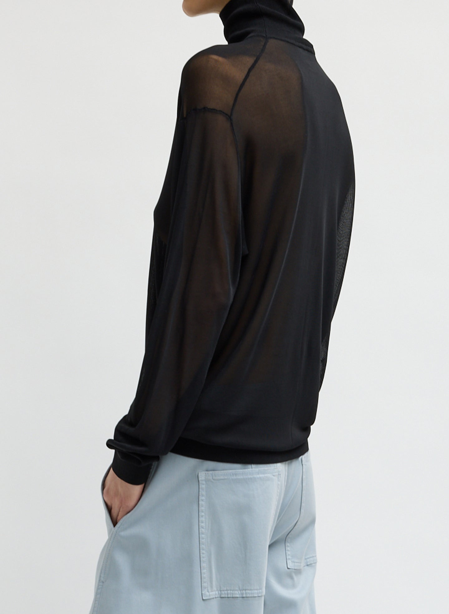 Black Slinky Viscose Perfect Men's Turtleneck - sheer turtleneck, side view on model