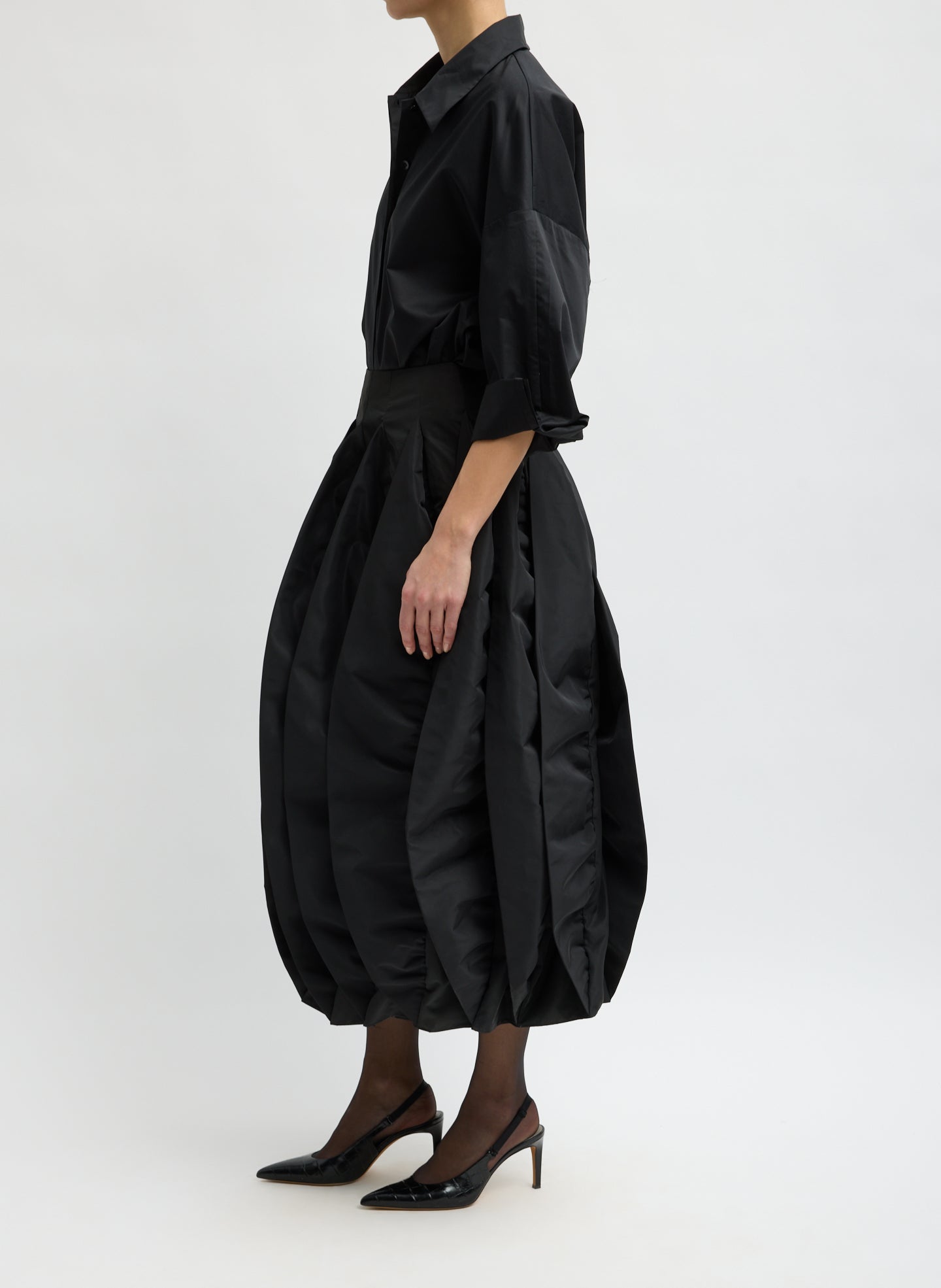 Black Recycled Italian Sporty Nylon Skirt - pleated bubble midi skirt, side view on model