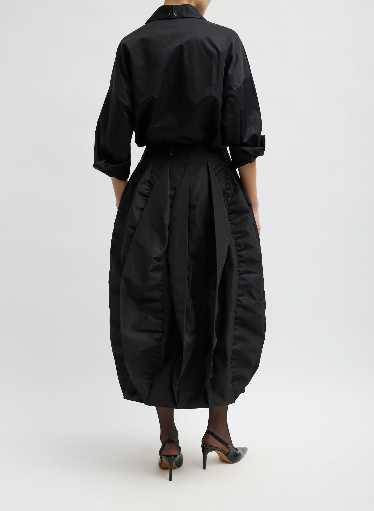 Black Recycled Italian Sporty Nylon Skirt - pleated bubble midi skirt, back view on model