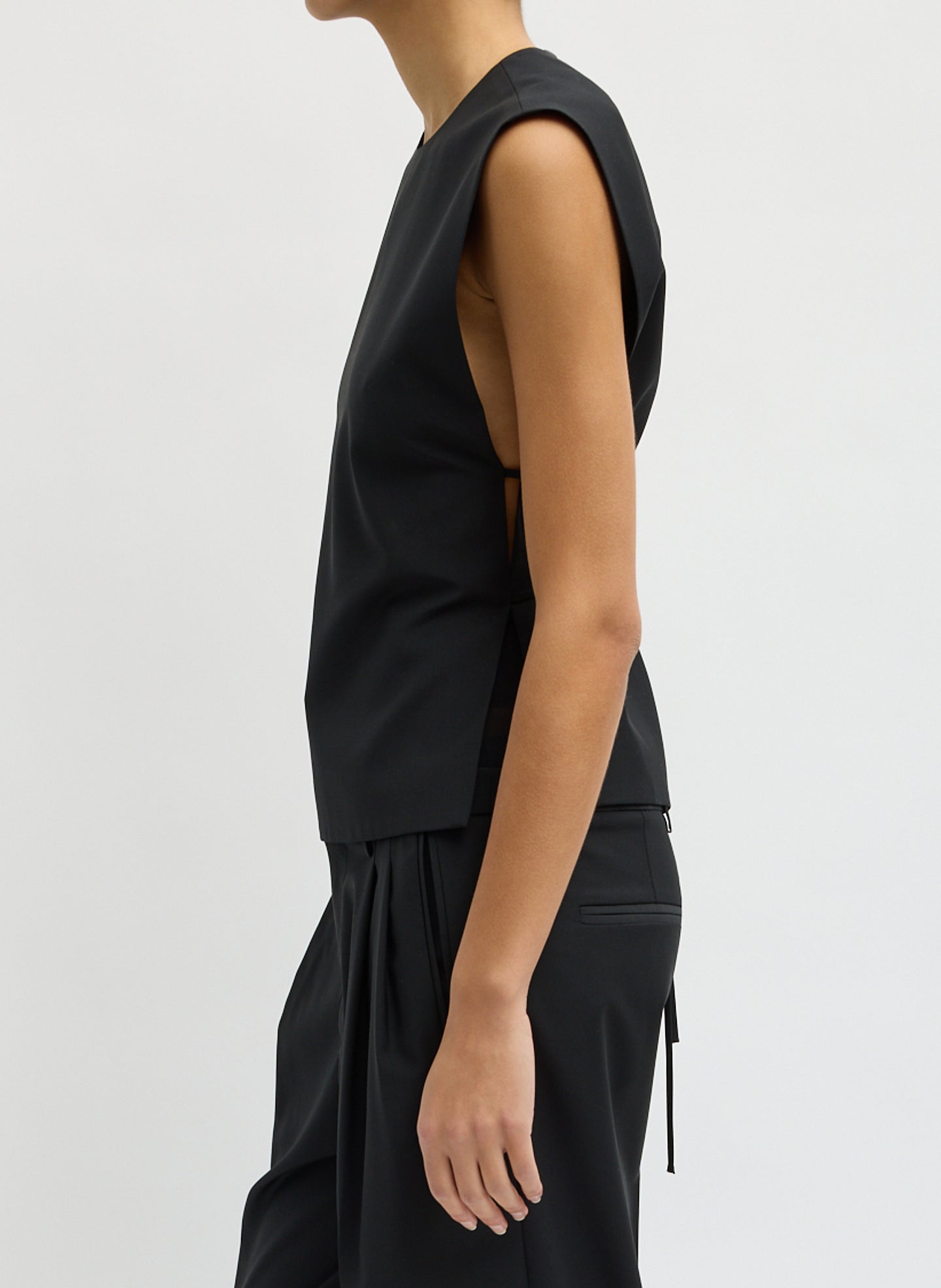 Black Recycled Tropical Wool Bib Top - sleeveless top, side view on model