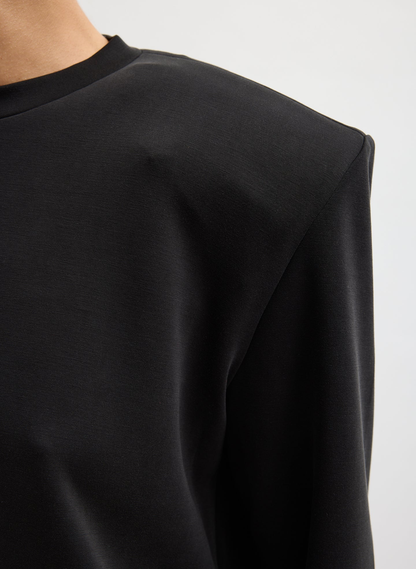 Black Feather Weight Viscose Removable Shoulder Pad Long Sleeve T-Shirt - closeup of shoulder pad detail