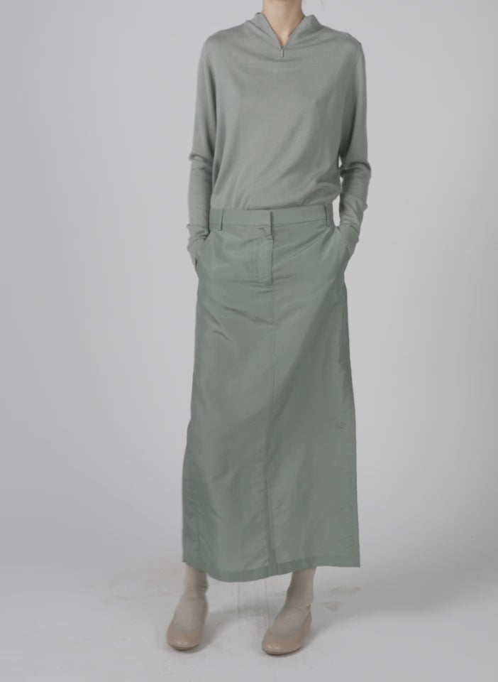 Model wearing the silk nylon maxi skirt pumice grey walking forward and turning around