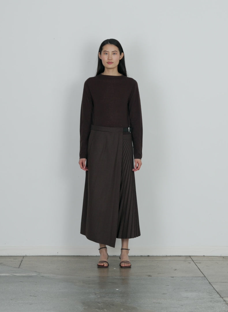 Model wearing the skinlike mercerized wool soft sheer pullover brown walking forward and turning around