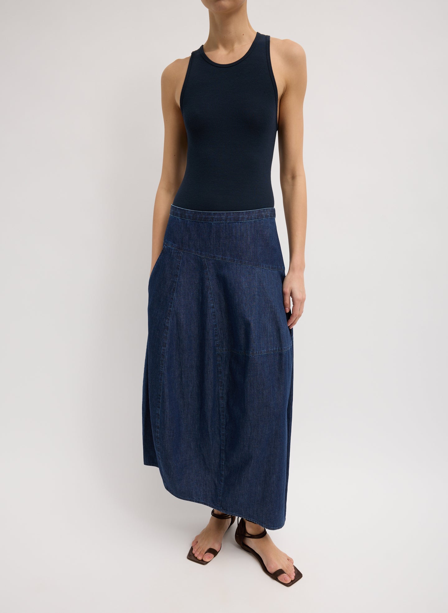 Light Weight Indigo Denim Asymmetrical Balloon Skirt - dark wash, front view on model