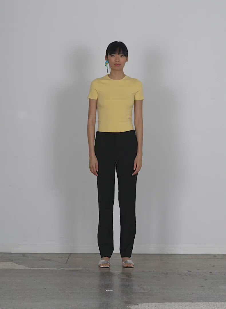 Model wearing the compact stretch cashmere kate mini t walking forward and turning around