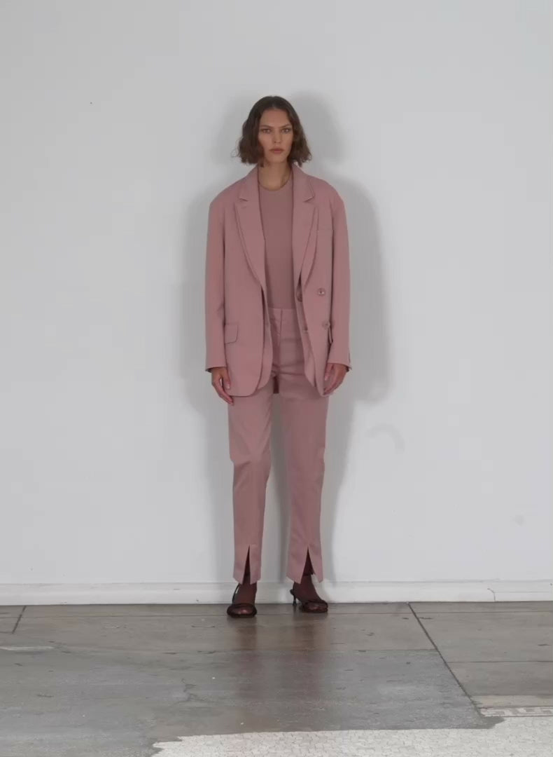 Model wearing the cassius suiting dbl layer liam blazer toffee brown walking forward and turning around