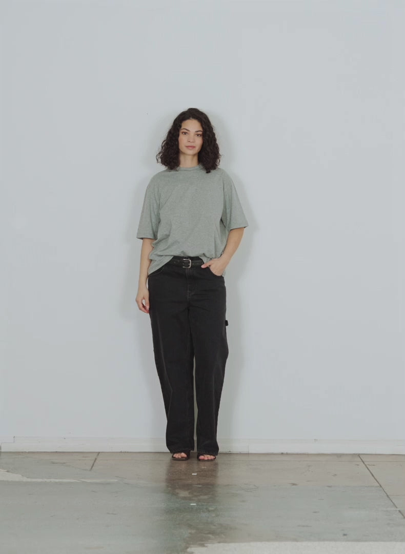 Model wearing the tshirt program mock neck unisex t heather grey walking forward and turning around