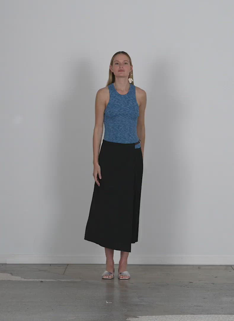 Model wearing the printed combed cotton sweater ribbed tank walking forward and turning around