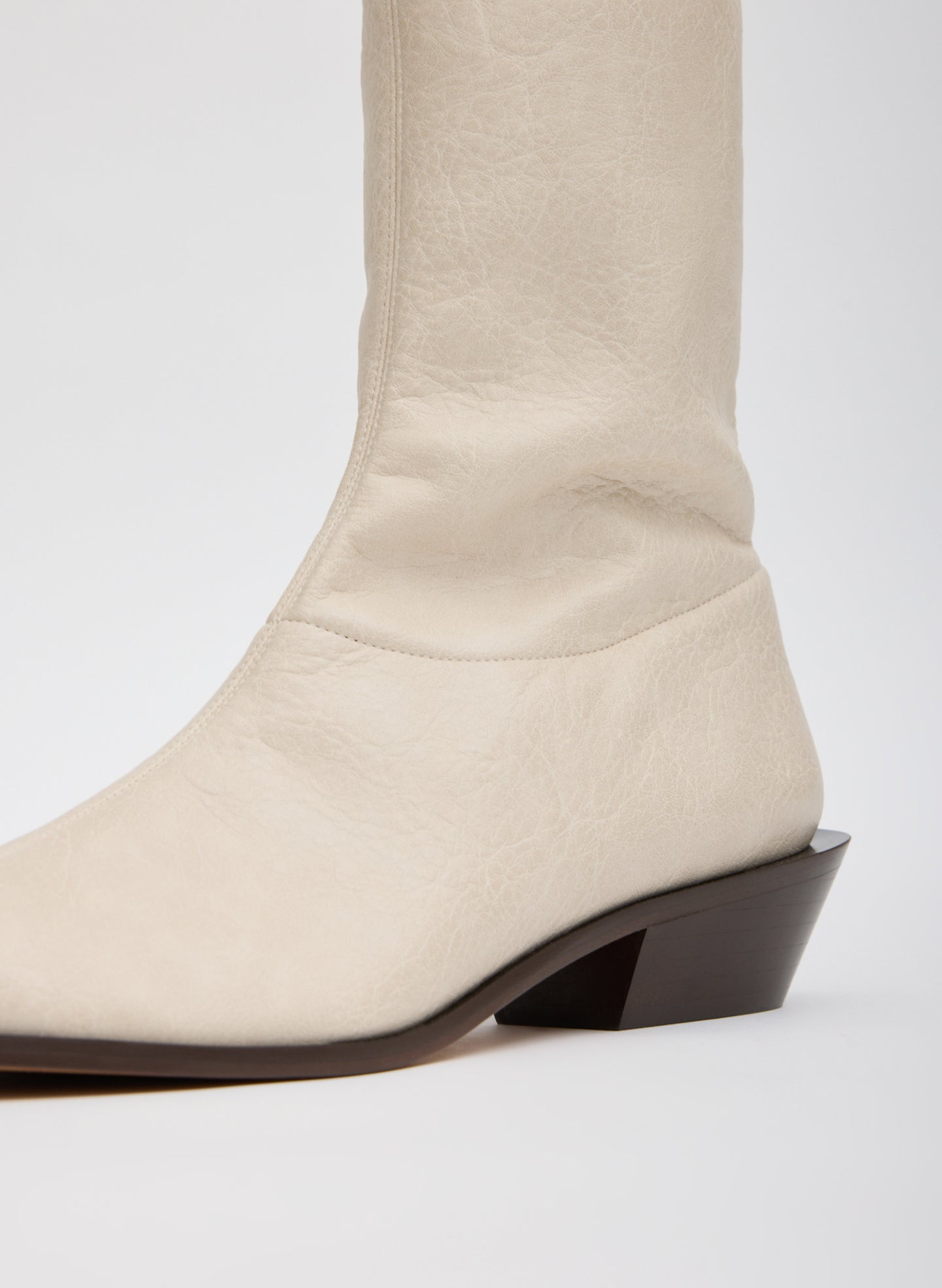 Off White Faux Leather Leo Boot - closeup of faux leather fabrication