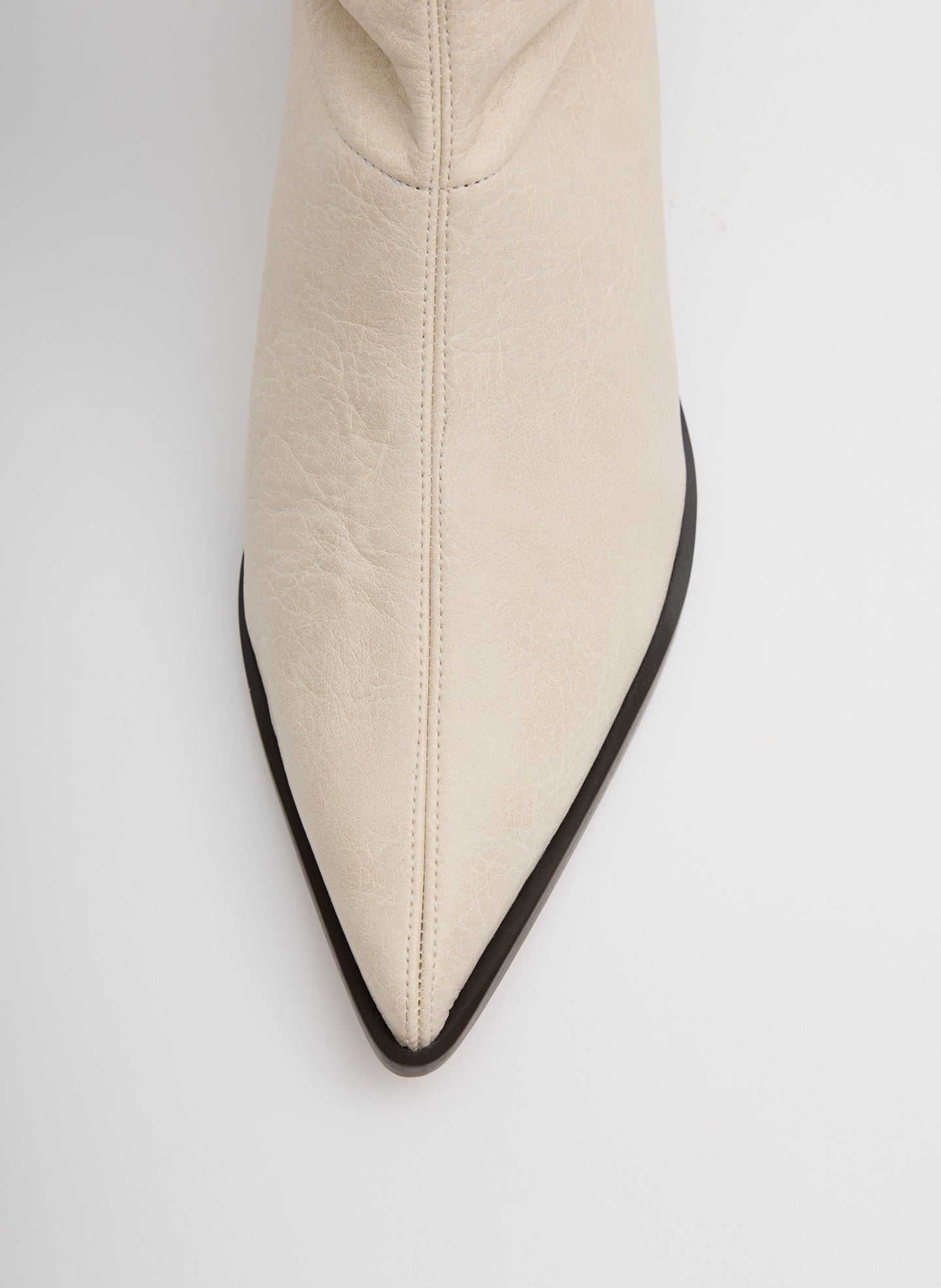 Off White Faux Leather Bronson Boot - tall, pointed toe boot - closeup of toe detail